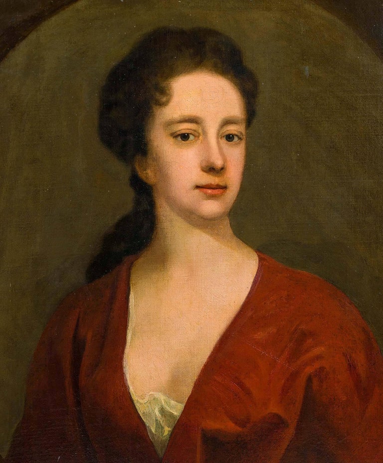 18th century portrait of a lady in the typical dress of the early Georgian period; chemise, modesty piece, vee décolletage, criss-cross bodice, full sleeves and hair arranged in a long straight coiffure. There is evidence of a pentiment about the