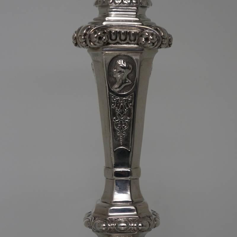 A very important pair of large 19th century cast candlesticks made by the most prominent silversmith of the mid Victorian era. The craftsmanship of the candlesticks has a decorative theme throughout, however more styled in an elegant and not over