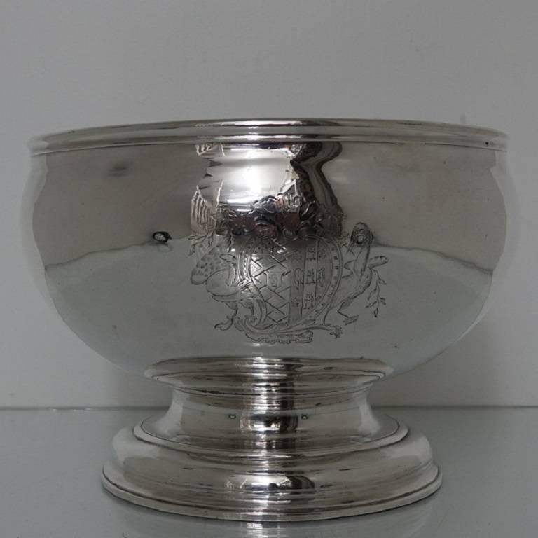 A very stylish and highly collectable large punch bowl, plain formed in design which sits on a circular raised pedestal foot. The bowl has an elegant contemporary coats of arms for importance.