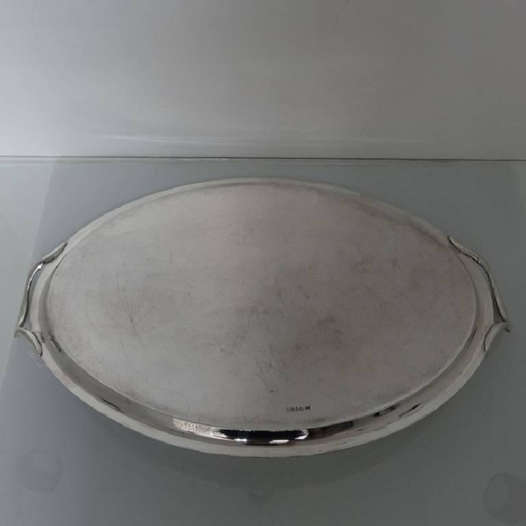 A very elegant early 19th century silver tray. The tray has a reeded border with raised half acanthus leaf handles. The centre has a very ornate cartouche in which sits a family crest of a unicorn. The hallmarks of the tray are struck on the