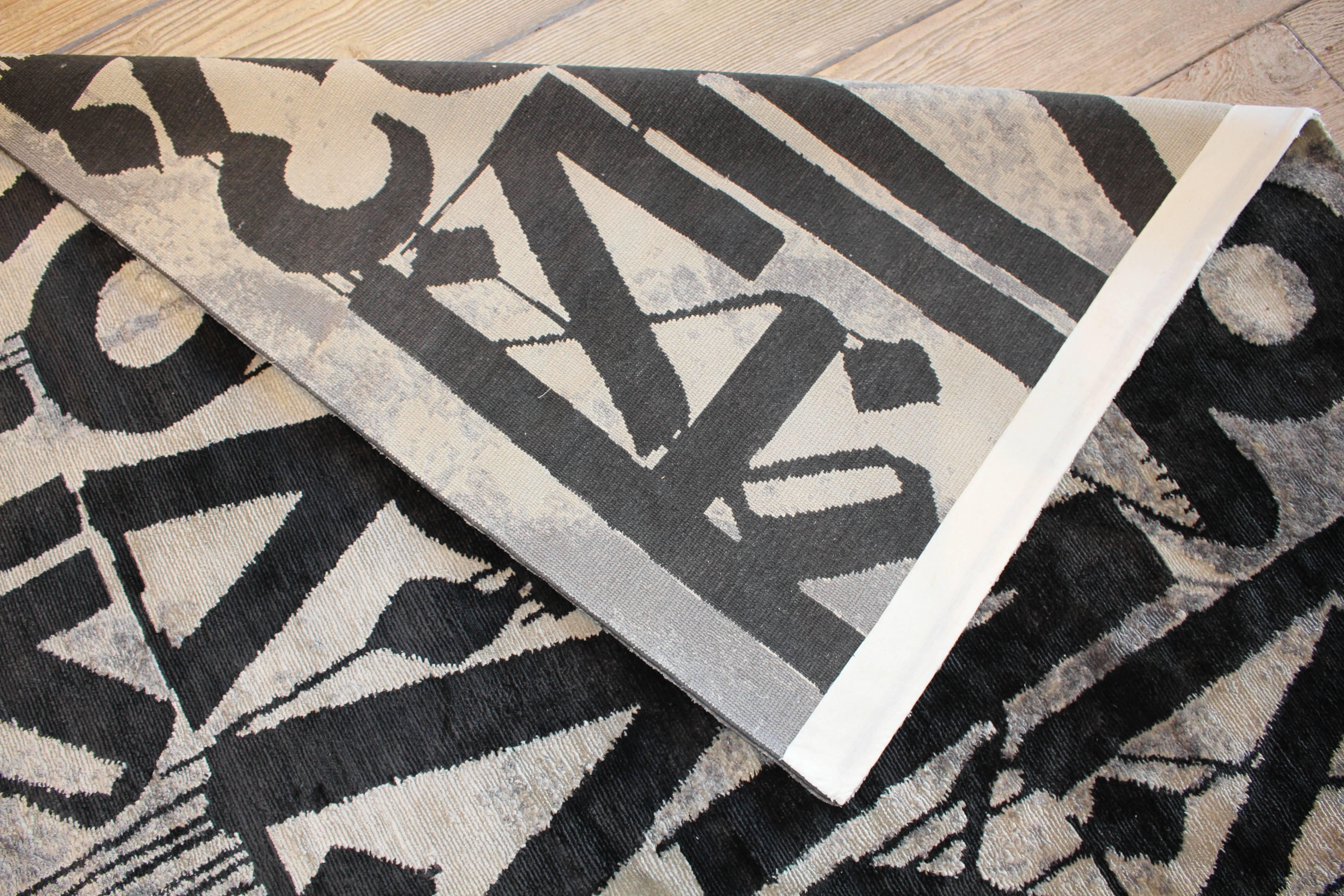 Resurrect is a limited edition silk rug by artist Retna. Measures 110" x 136".