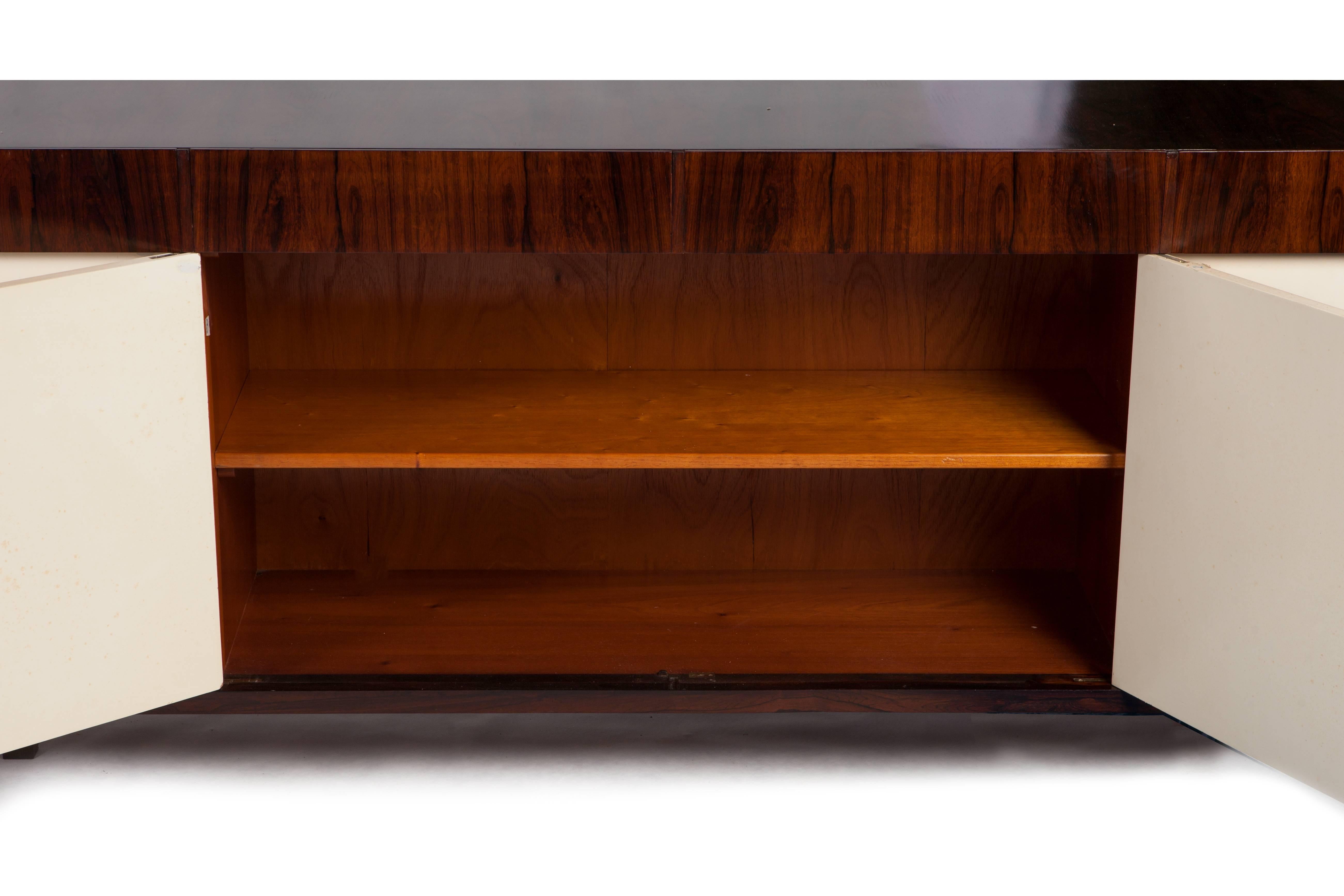 This monumental 13-foot Brazilian modern rosewood (Jacaranda) cabinet-buffet was a privately commissioned piece designed by Joaquim Tenreiro.
