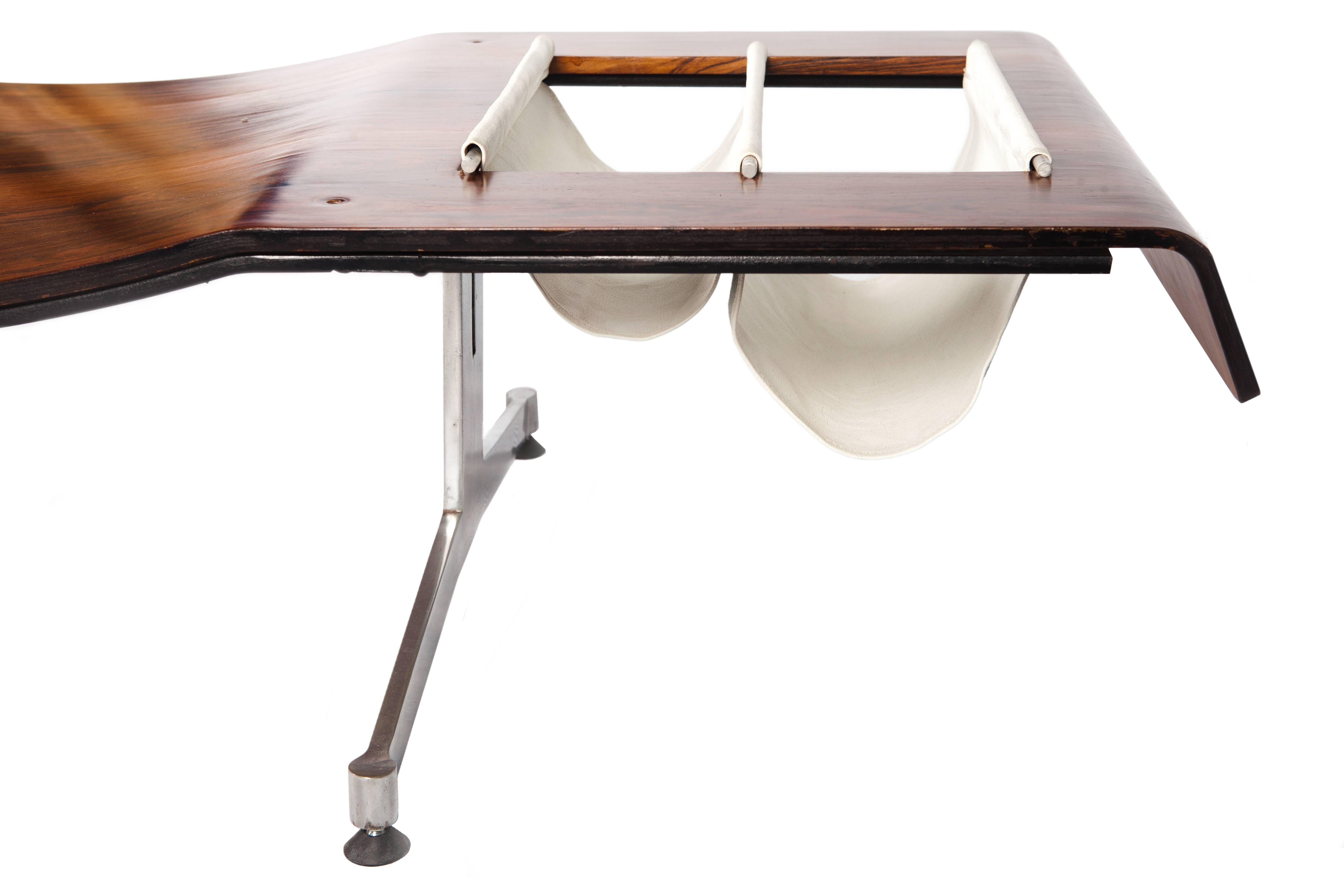 This Brazilian modern rosewood (jacaranda) bench designed by Jorge Zalszupin was named "Onda," meaning "wave" in Portuguese. It has a white leather magazine holder.