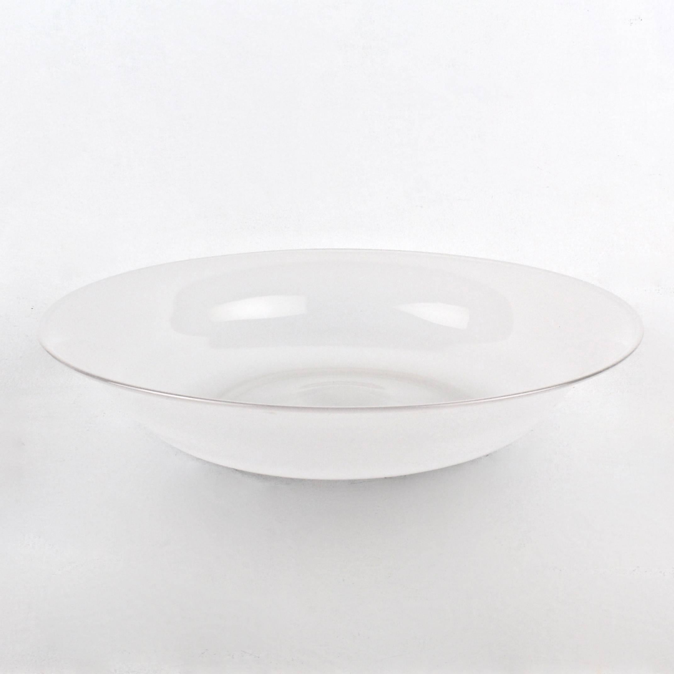 A rare large opaque white glass footed bowl by Venini.

It bears a Mid-Century acid-etched circle mark in the polished pontil to the base. 

Diameter: circa 15.25 in. 

Items purchased from David Sterner antiques must delight you. Purchases