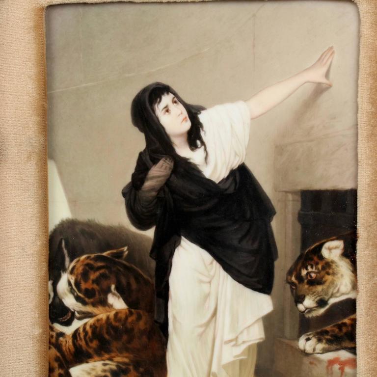 A finely painted 19th century Berlin type porcelain plaque depicting Euphemia. The painting shows the Virgin Martyr Euphemia thown amongst the leopards and hyenas; none of which will harm her because of her purity.

The plaque is mounted in an