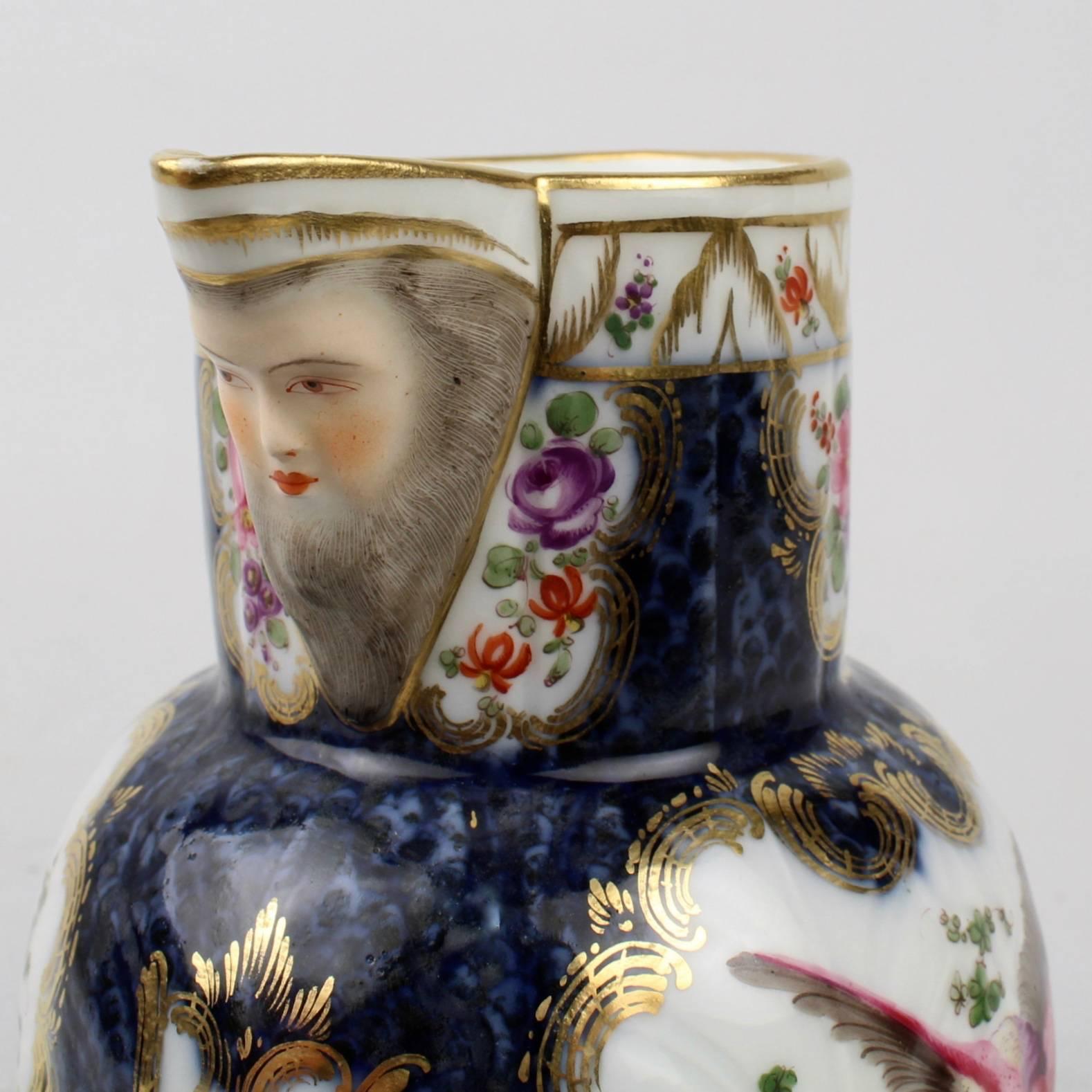 A wonderful, antique Samson porcelain water pitcher or milk jug. 

Having a figural spout with the face of the Northwind, polychromed birds of paradise, and blue scale and gilt decoration.

Samson et Cie was founded in the 1830s and quickly