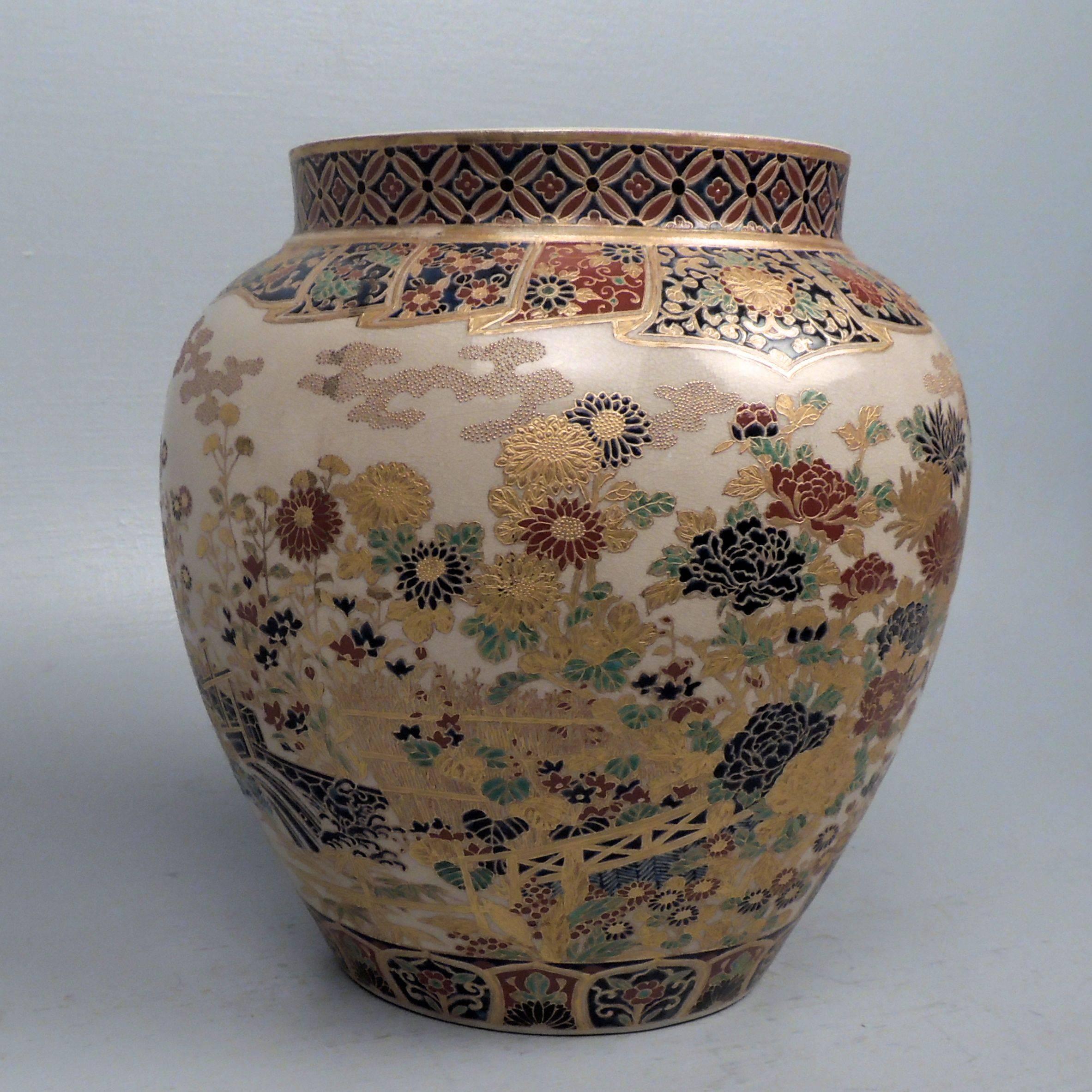 A fine and large Satsuma pottery vase with extensive red, green, gosu blue and gold decoration. Rich and (almost explosively) vibrant decoration throughout.

The base bears an artist’s signature or factory mark as well as large blue mon