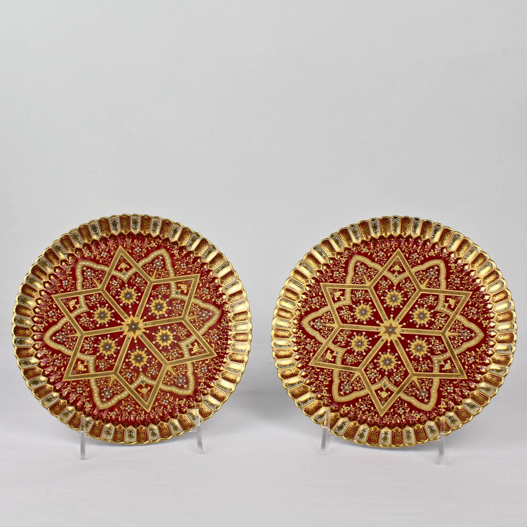 A pair of 19th century Copeland porcelain cabinet plates with orientalist decoration.

Each with a burgundy ground, several different tones of gilding (some of which is heavy and raised gold) and green and white enamel jeweling.

Reverese bears