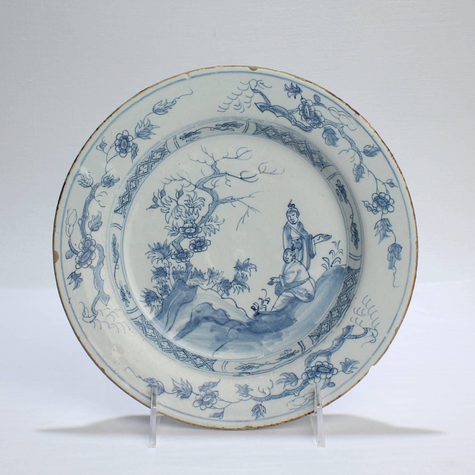 A fine pair of 18th century English Delft plates.

Each with blue chinoiserie landscapes and figures.

Diameter: circa 8 3/4 in.

Items purchased from David Sterner Antiques must delight you. Purchases may be returned for any reason for a