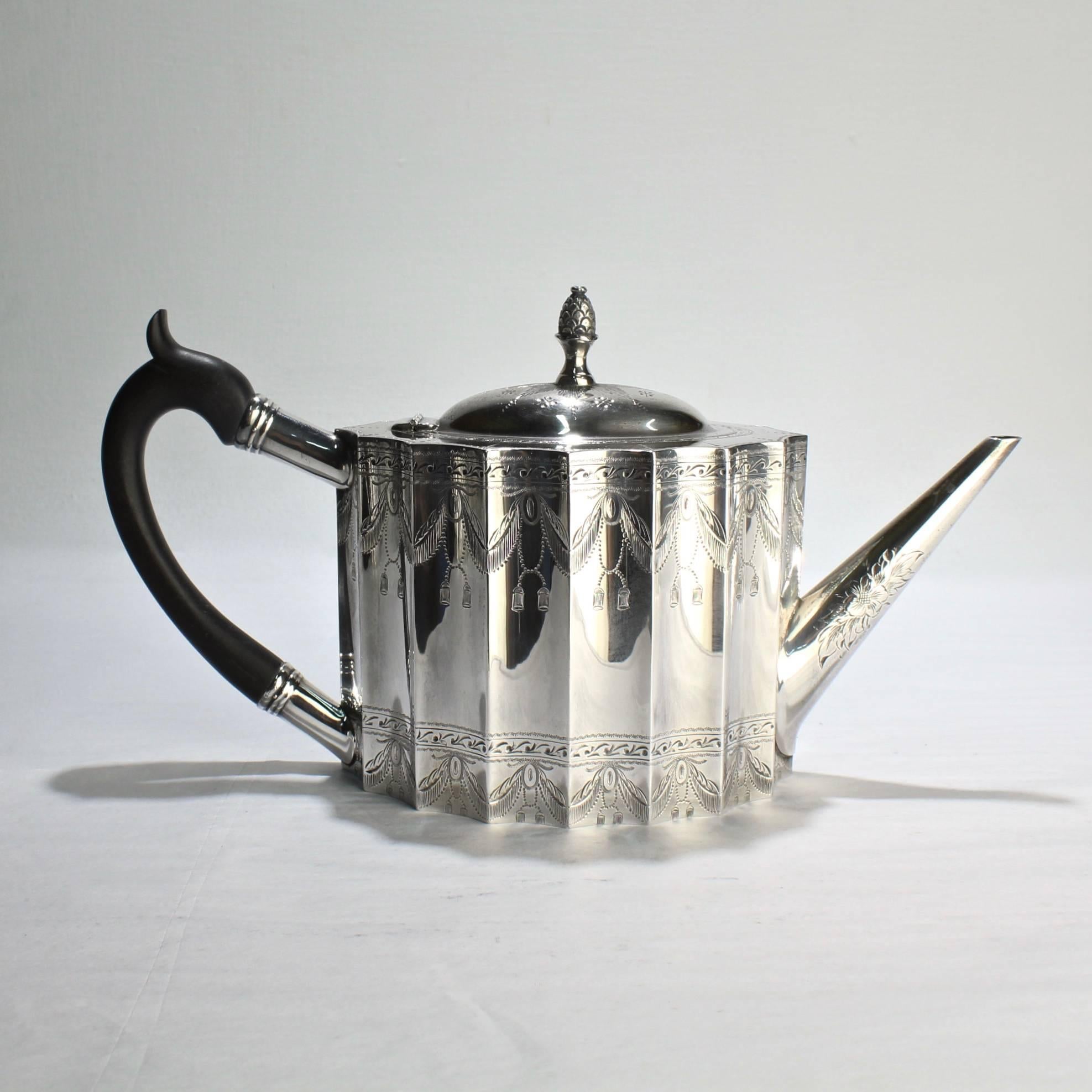 An engraved Paul Revere pattern four piece tuttle sterling silver coffee or tea service, 1929-1933.

Measurements:
Teapot height 7 in., width 11 in., depth 4 1/16in.
Sugar height 5 1/2 in., width 7 3/4 in., depth 3 1/4 in.
Creamer height 4 5/8