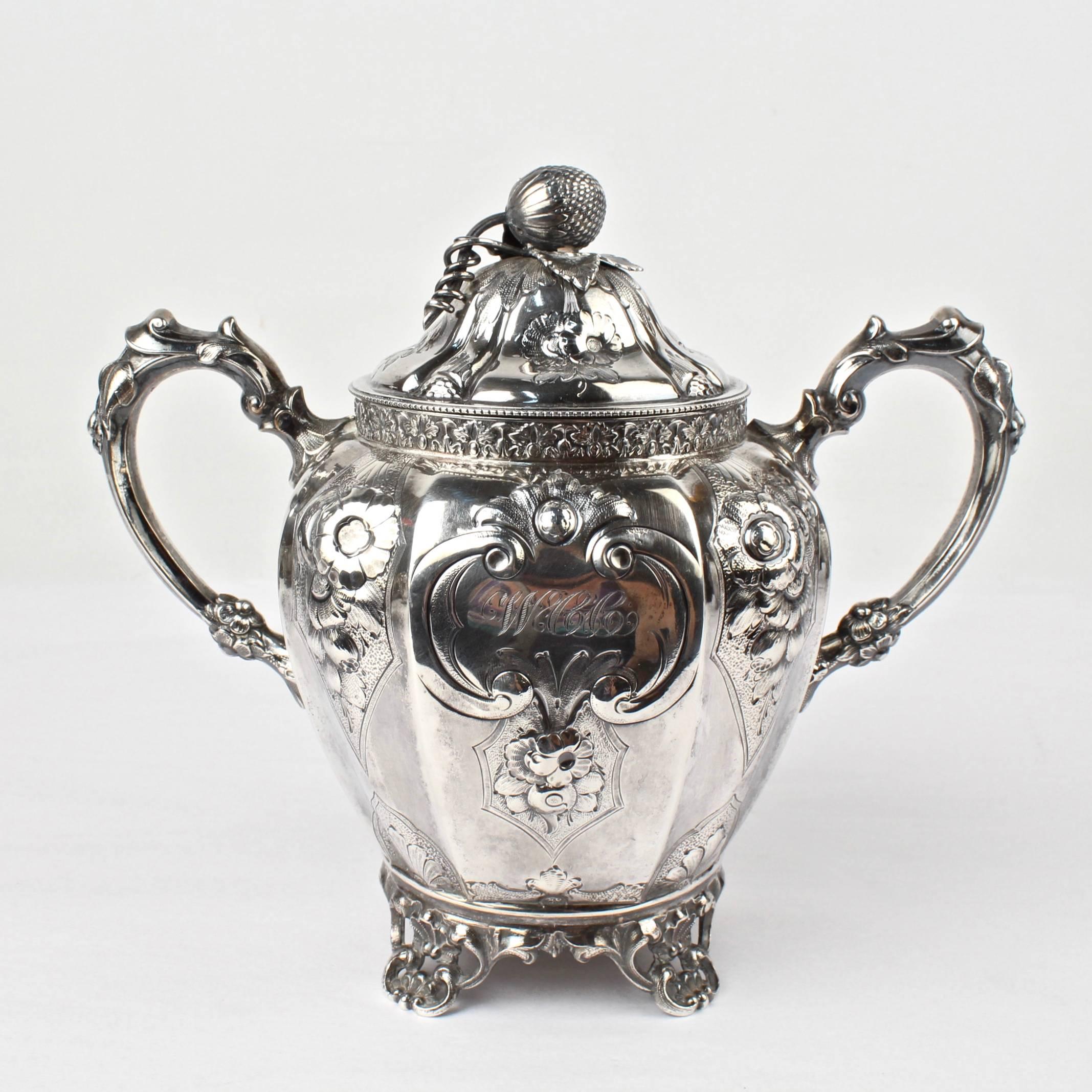 American 19th Century Four-Piece Wood and Hughes Repousse New York Coin Silver Tea Set For Sale