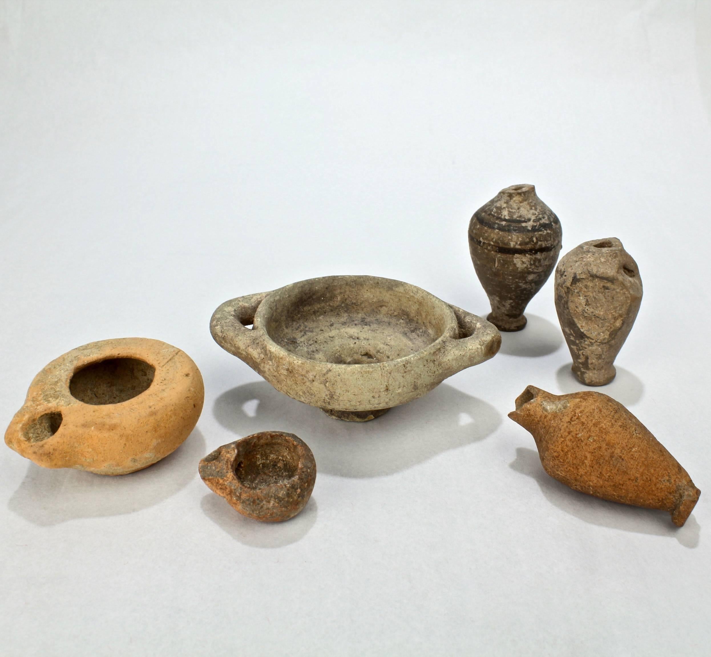 A group of six old (and possibly ancient) terracotta vessels.

Perfect for the collecting Kunstkammer or Curiosities cabinet.

In varying as-pictured condition.

Tallest object height: circa 3 3/4 in.

Items purchased from David Sterner