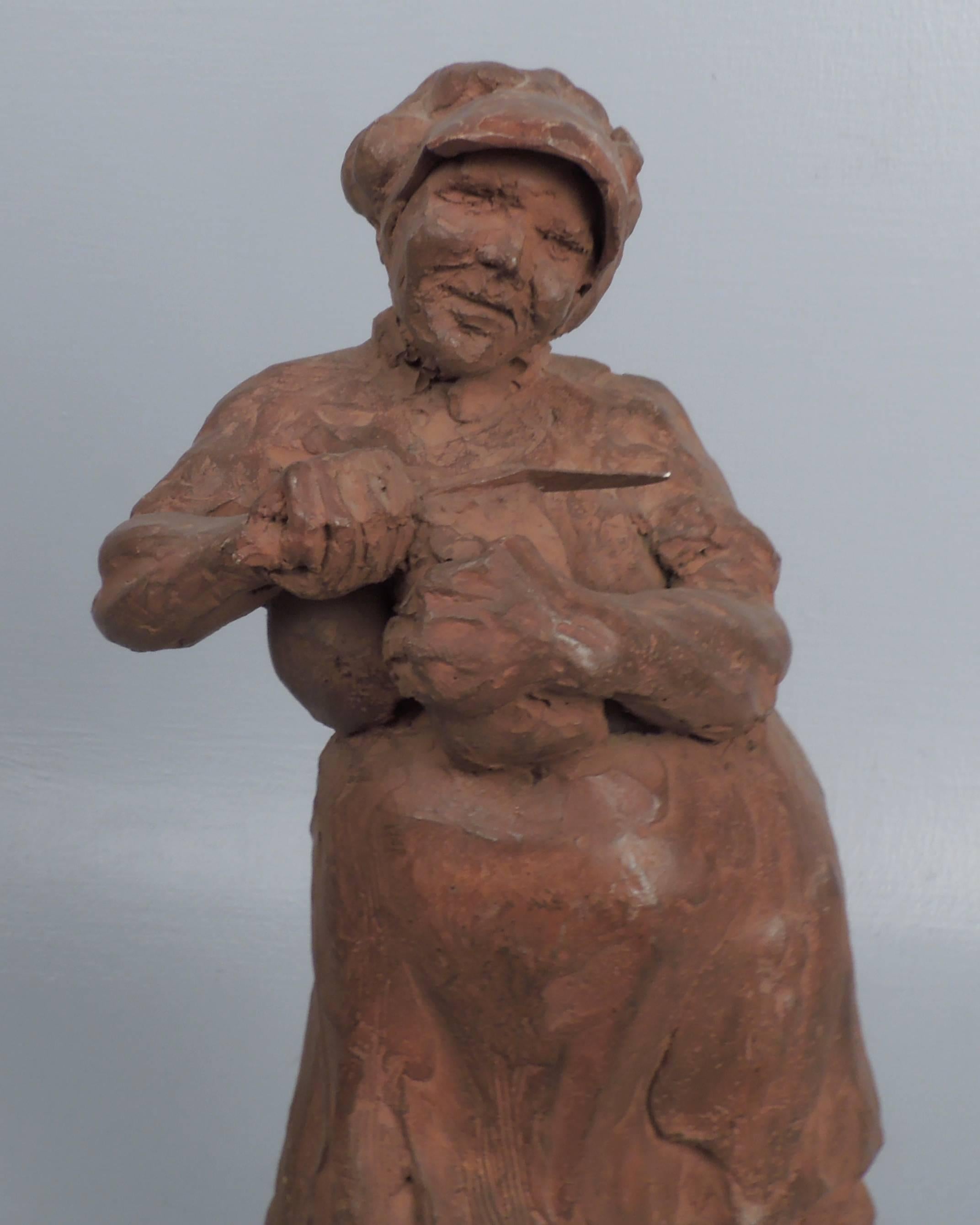 A ceramic sculpture of a rotund woman slicing bread by the Cuban-American sculptor, Roman Lago.

Height: circa 13 1/4 in.

Items purchased from David Sterner Antiques must delight you. Purchases may be returned for any reason for a period of 7