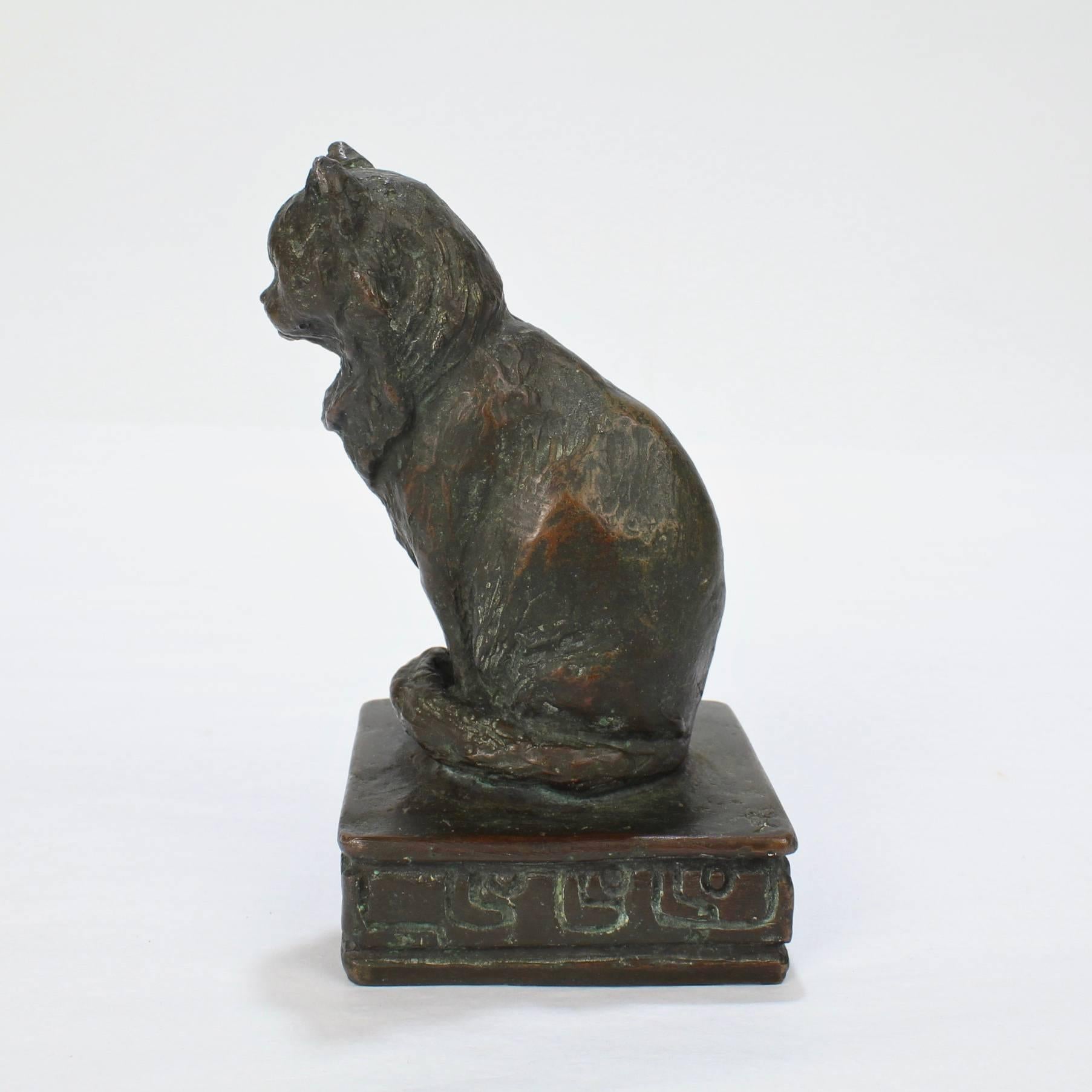 A fine, desk top size bronze sculpture of a Persian cat by Ruth Walker Brooks.

Brooks was a student Anna Vaughn Hyatt in New York.

The bronze has a warm patina with spots of green oxidation.

Measures: Height: circa 4 3/4 in.

Items purchased from