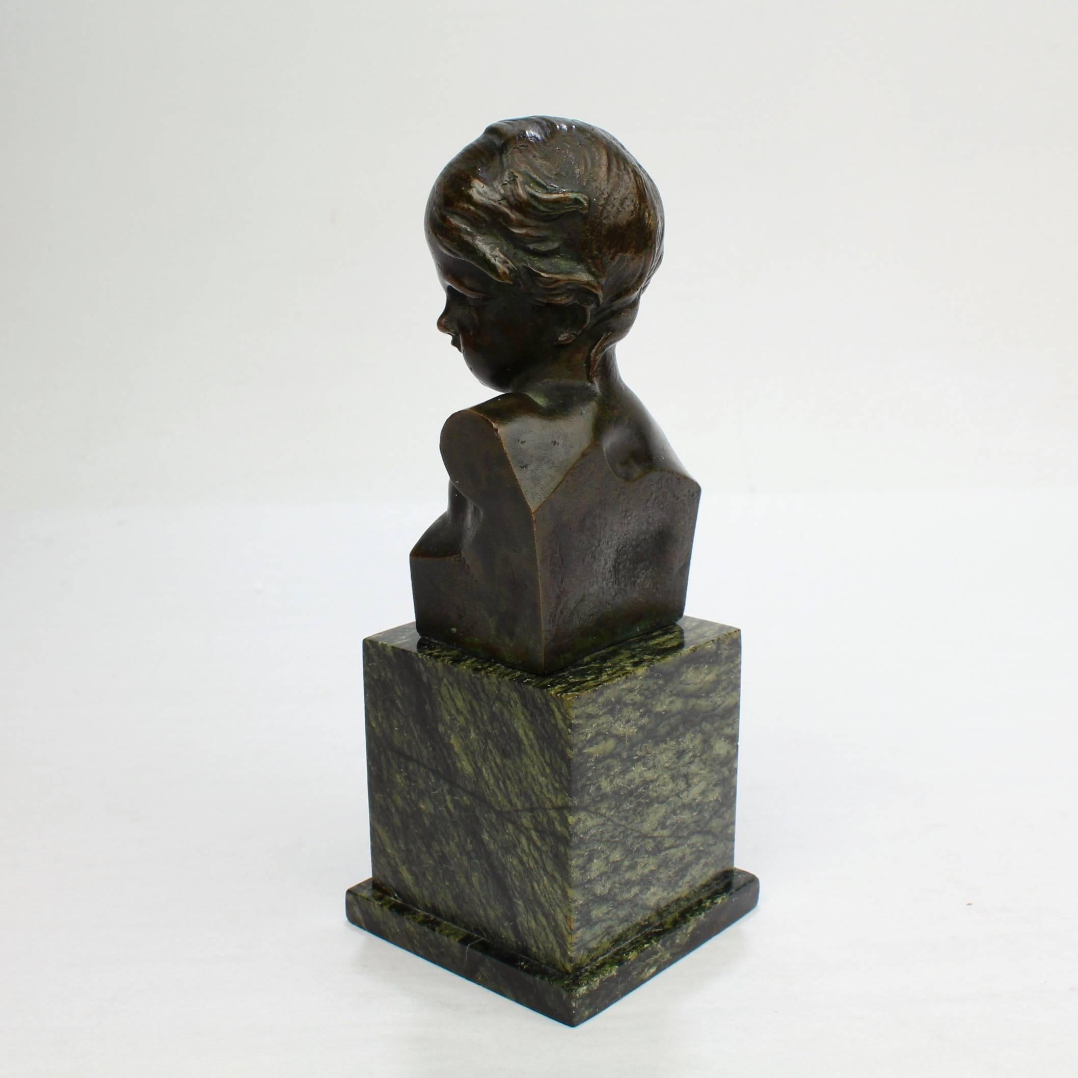 Neoclassical Small Antique Bronze Bust of a Child after Jean-Antoine Houdon For Sale