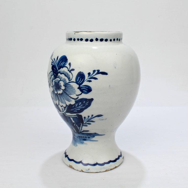 A very fine 18th century Dutch Delft pottery vase or jar.

Of typical vasiform shape with medium and deep blue Chinoiserie landscape decoration, dot border to the top rim, and swag border to the foot.

Height: circa 7 1/2 in.

Items purchased