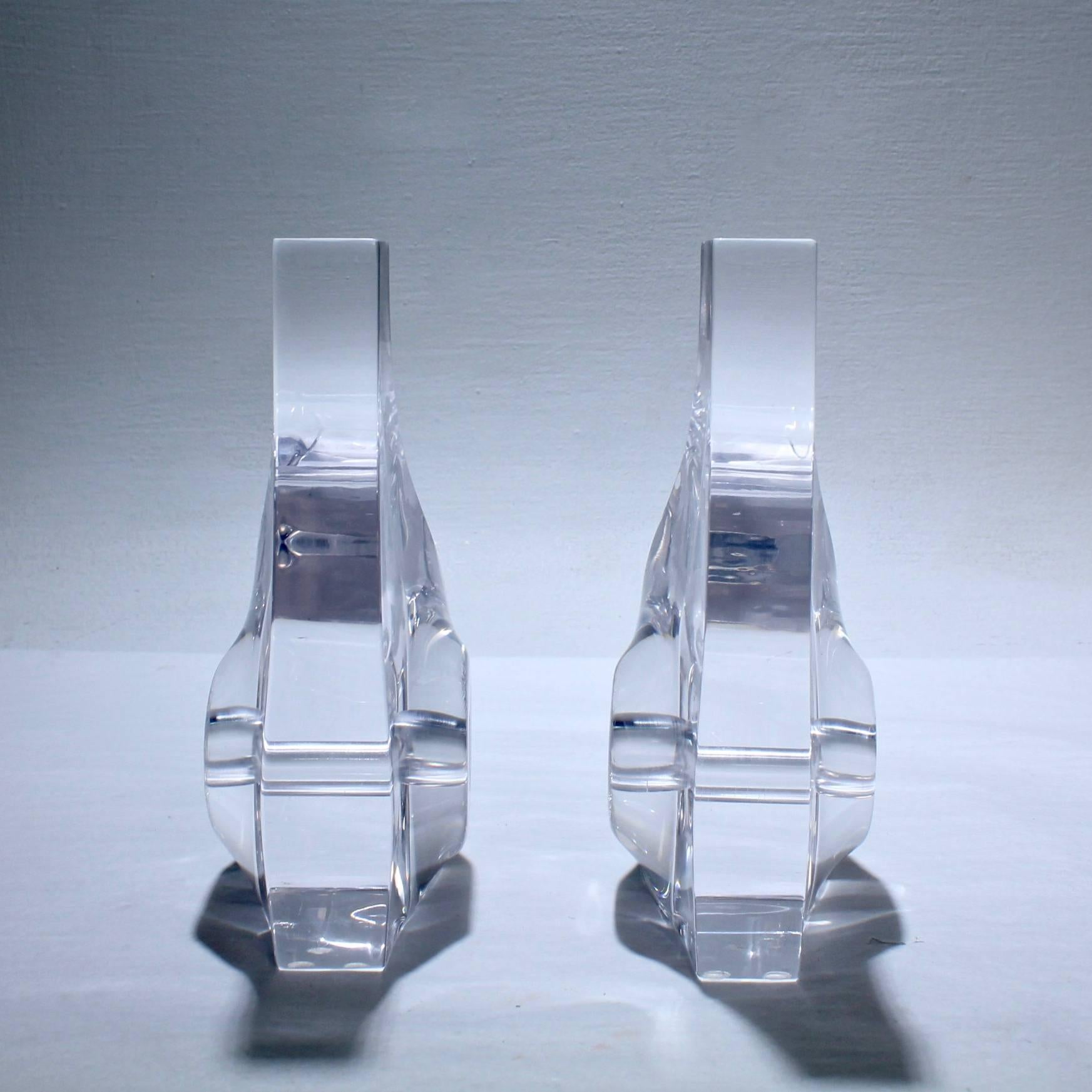 A good pair of Ritts Astrolite Lucite bookends, 

of an abstract, modernist design with pierced central openings.

Height: circa 6 3/4 in.

Items purchased from David Sterner Antiques must delight you. Purchases may be returned for any reason