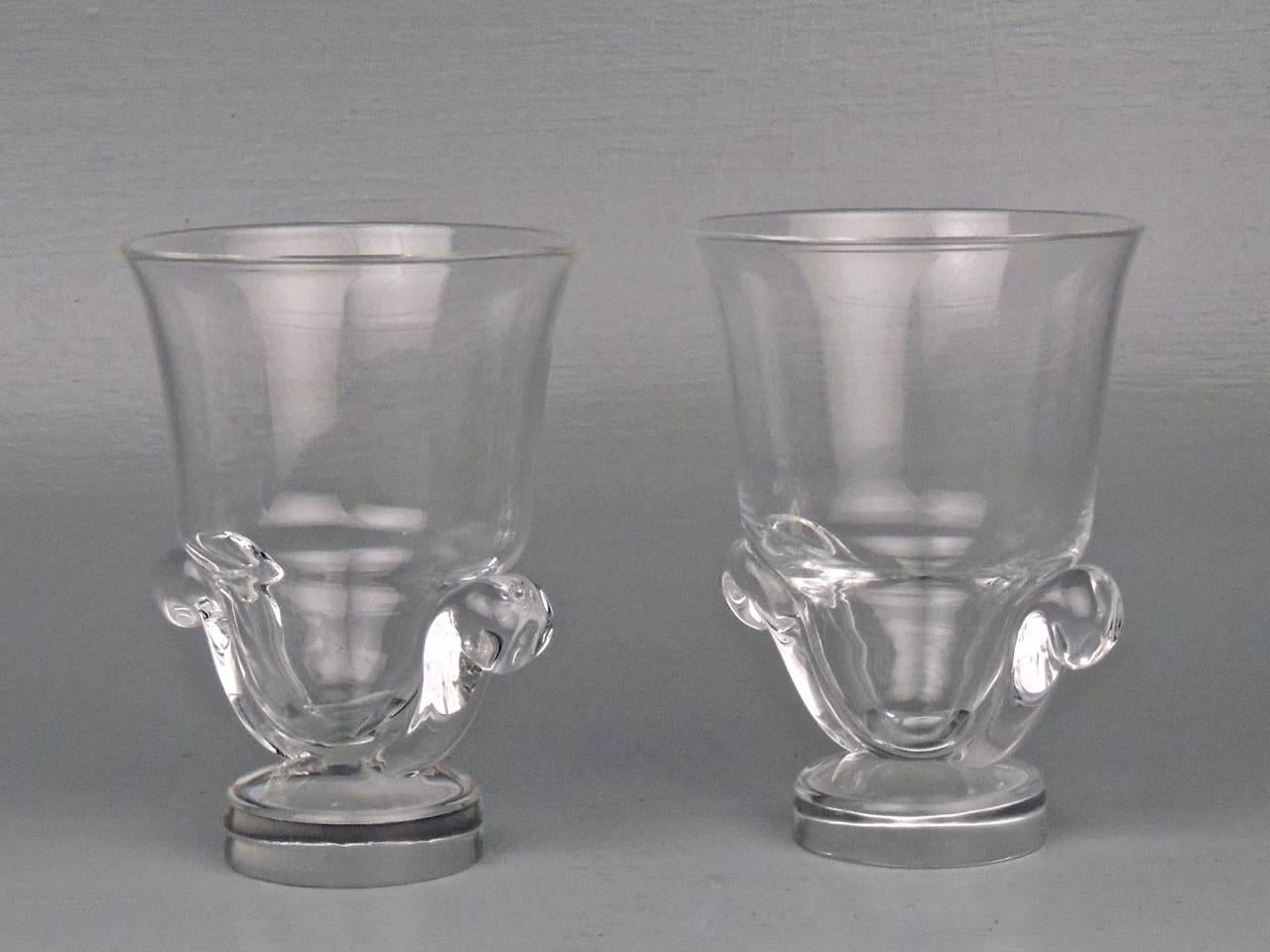 A good pair of Steuben vases with scroll handle and disc feet.

Designed by George Thompson in 1948.

Marked Steuben to bases.

Height: ca. 6 in. 

Items purchased from David Sterner Antiques must delight you. Purchases may be returned for