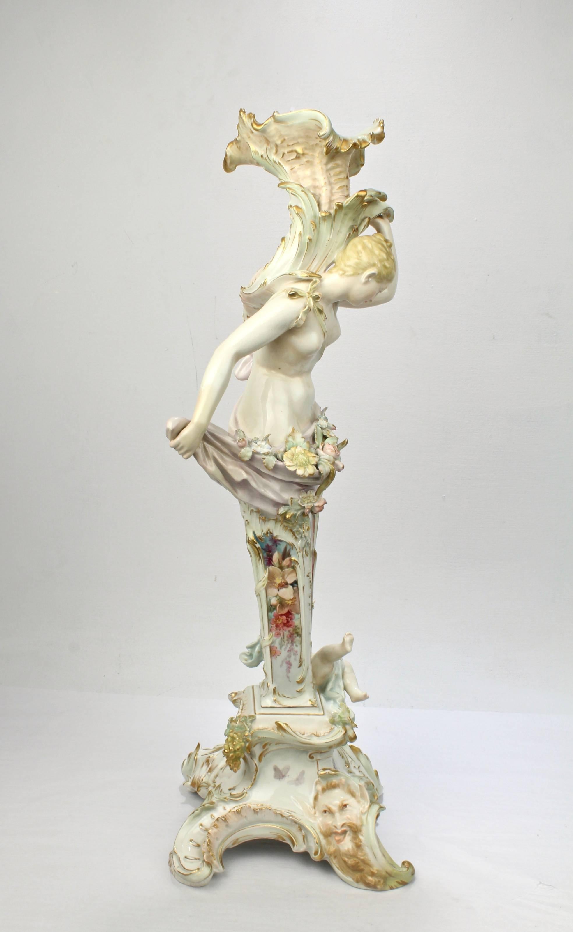 An extremely rare, figural KPM porcelain candlestick or candelabrum base with Weichmalerei decoration. 

A tour de force in technical and decorative achievements.

Designed by Paul Schley for the KPM Royal Berlin Porcelain Manufactory in 1886,