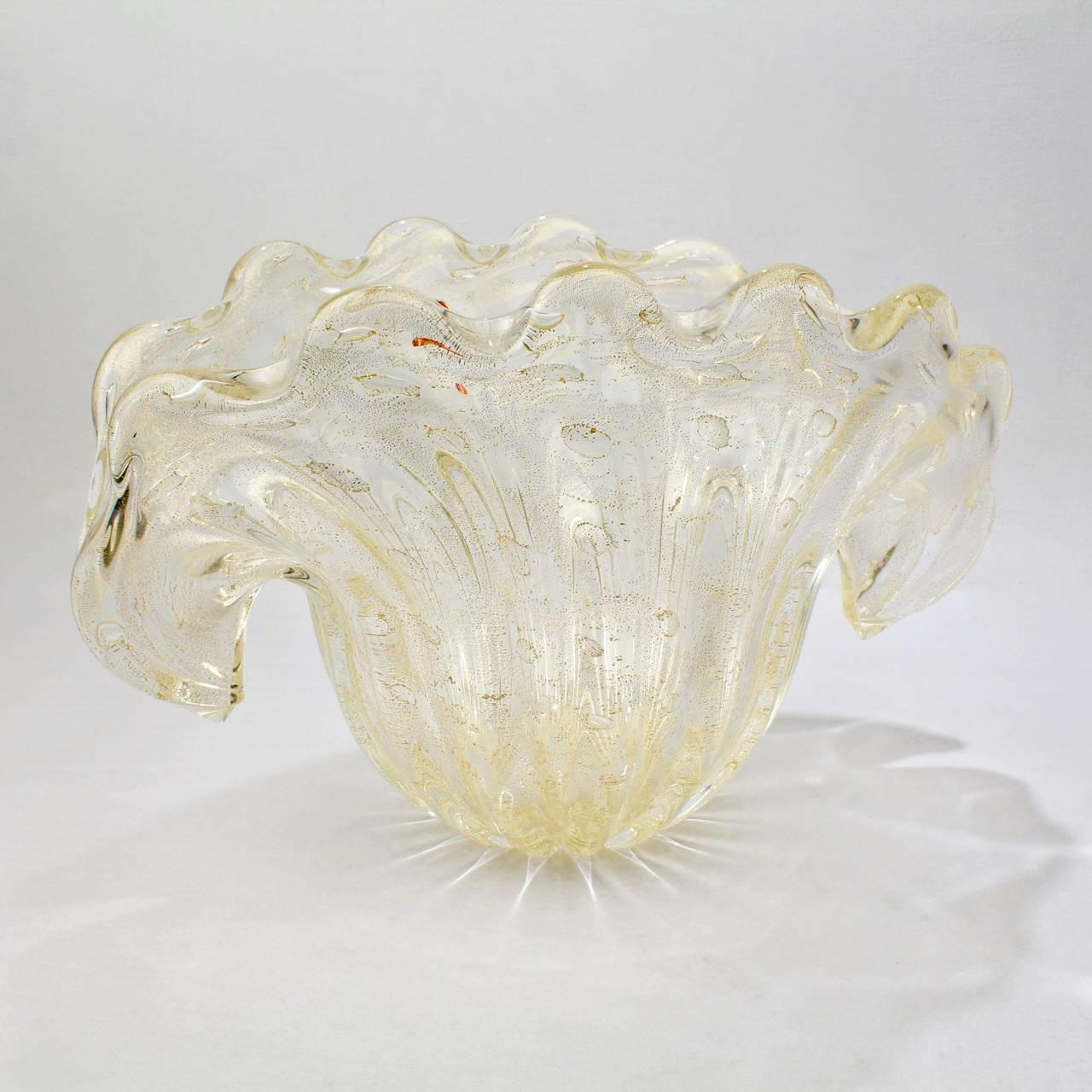 A very large Mid-Century Murano clam shell vase or centerpiece. 

Attributed to Barovier.

A ribbed or fluted, very light gold (almost clear) color glass with gold fleck inclusions and captured bubble decoration throughout. 

The base with a