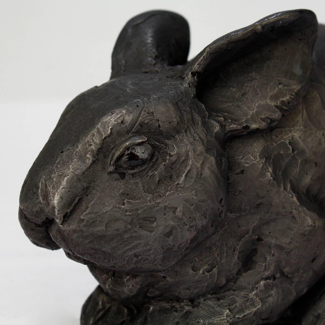 Title: Pygmy rabbit.

A cast black gesso and raw graphite resin sculpture by Darla Jackson.

Date: 2016.

Length: ca. 4 3/4 in.

Also available in bronze on commission basis at $1000. 

Darla Jackson was born in Pennsylvania in 1981. She