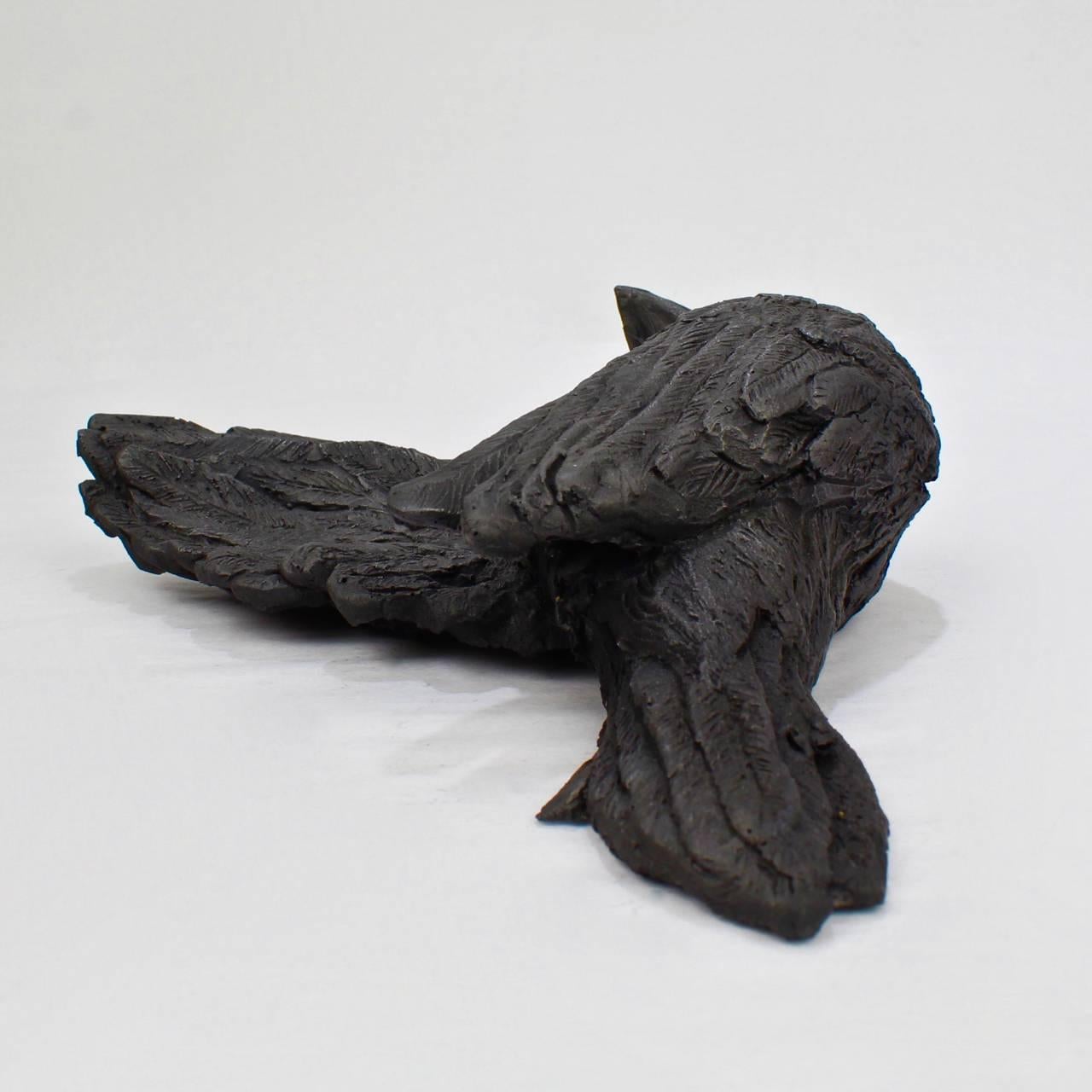 Title: We All Fall Down II.

A cast black gesso and raw graphite resin sculpture of a fallen bird by Darla Jackson.

Date: 2016.

Length: ca. 7 3/4 in.

Also available in bronze on commission basis at $1500. 

Darla Jackson was born in