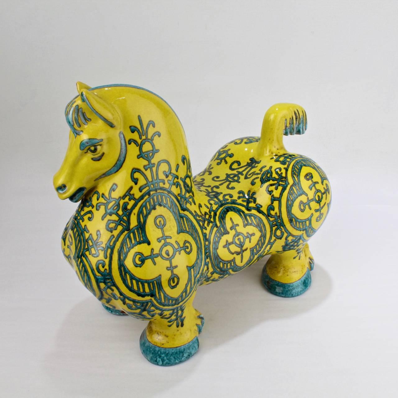 An Italian atomic-age glazed pottery horse sculpture attributed to the Mancioli Studios. 

Produced for Raymor in a canary yellow glaze with psychedelic turquoise decoration and highlights.

Width: circa 13 in.

Items purchased from David