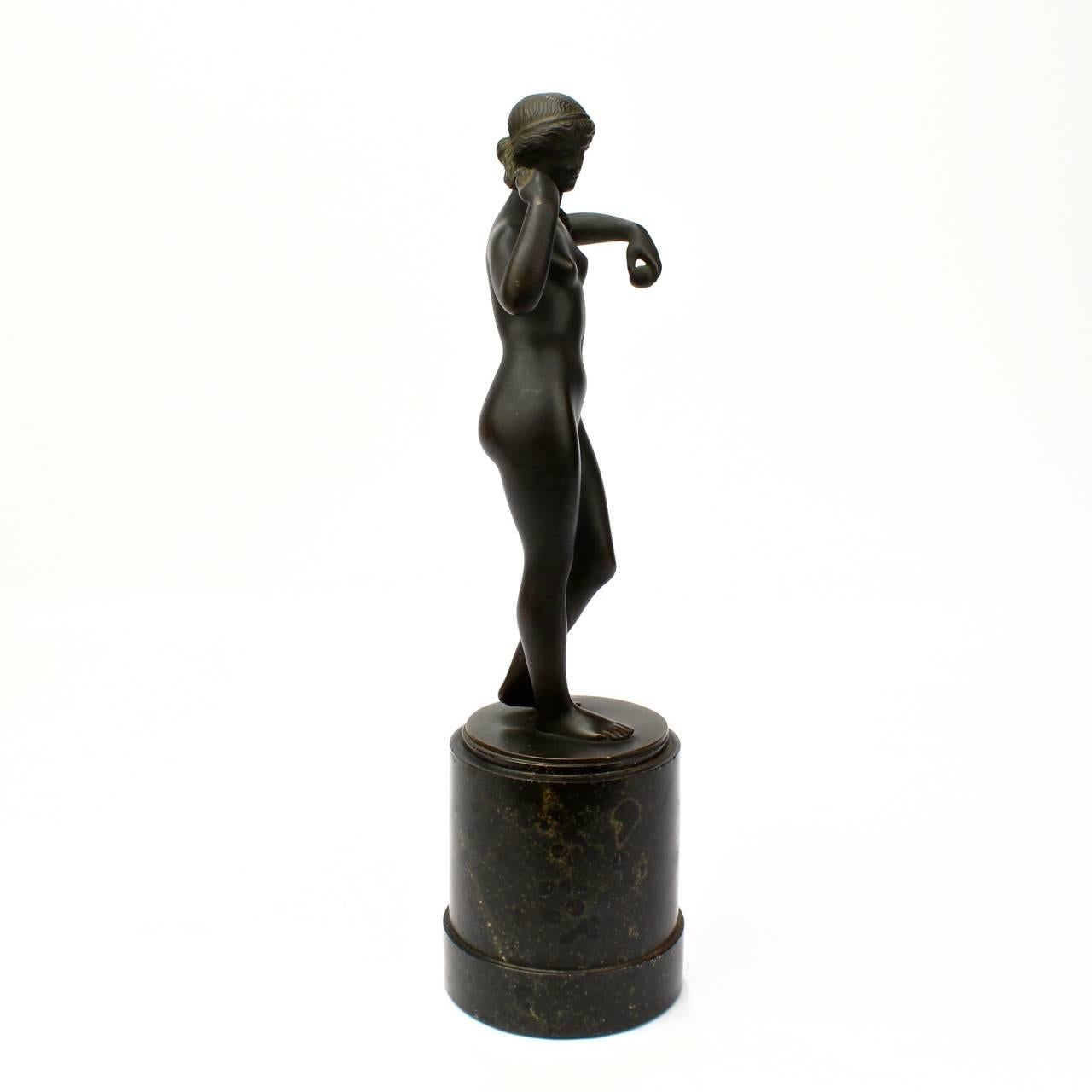A fine bronze model of a Venus on a slate plinth. 

Label to the base identifies it as after the sculpture by Polykleitos. 

The very edge of the bronze base is marked for the foundry - PBR von Co München. 

Height (including plinth): circa 9