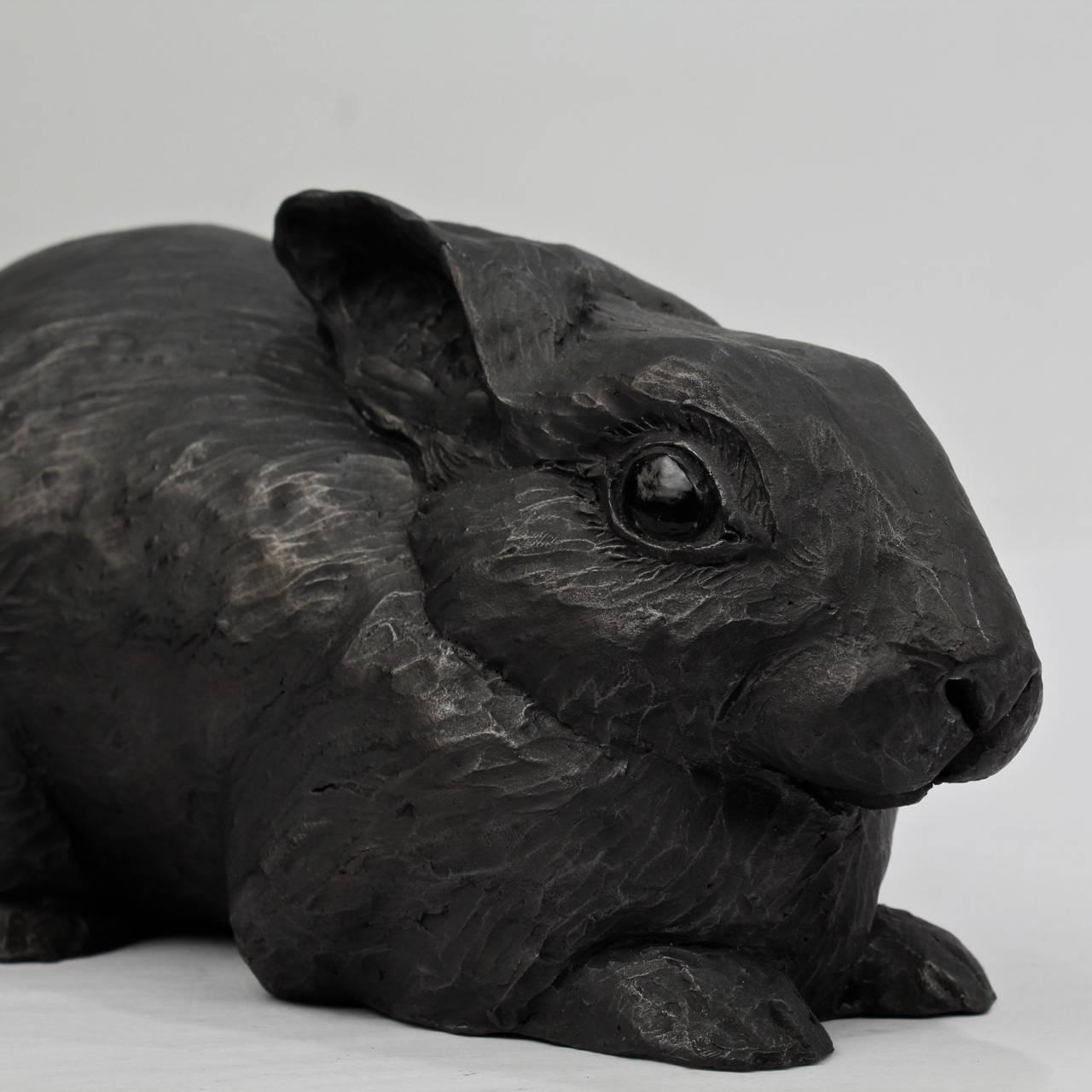 Title: When Bad Things Happen.

A unique black painted terracotta sculpture of a rabbit by Darla Jackson.

Date: 2014.

Length: ca. 8 in.

Signed to the reverse with the artist's monogram of a D in heart.

Darla Jackson was born in