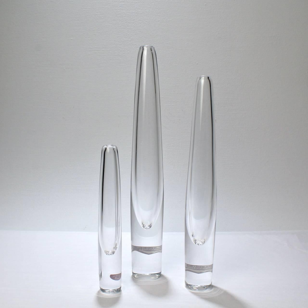 A fine group of three Orrefors Sputnik vases.

Originally designed and produced by stromberghyttan by Asta and Gerda Stromberg in mid-20th century.

Orrefors acquired stromberghyttan in the 1976 and promptly reissued this iconic design. 

Each