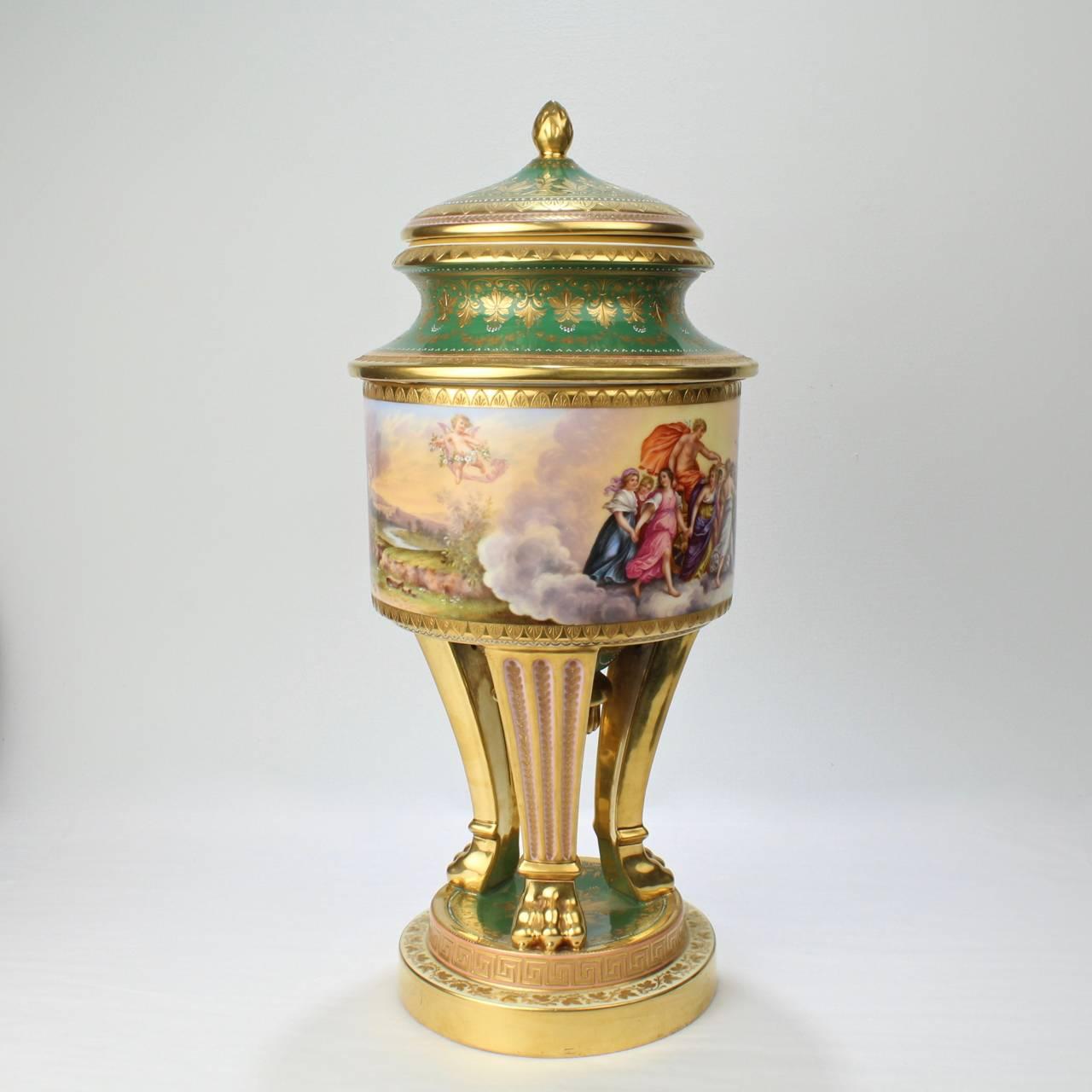 A large, heavily gilt Royal Vienna porcelain covered urn of exceptional quality. 

With hand painted scenes of Aurora and the Triumph of Venus around the body.

Constructed in three pieces with a lid and a second central section resting on a