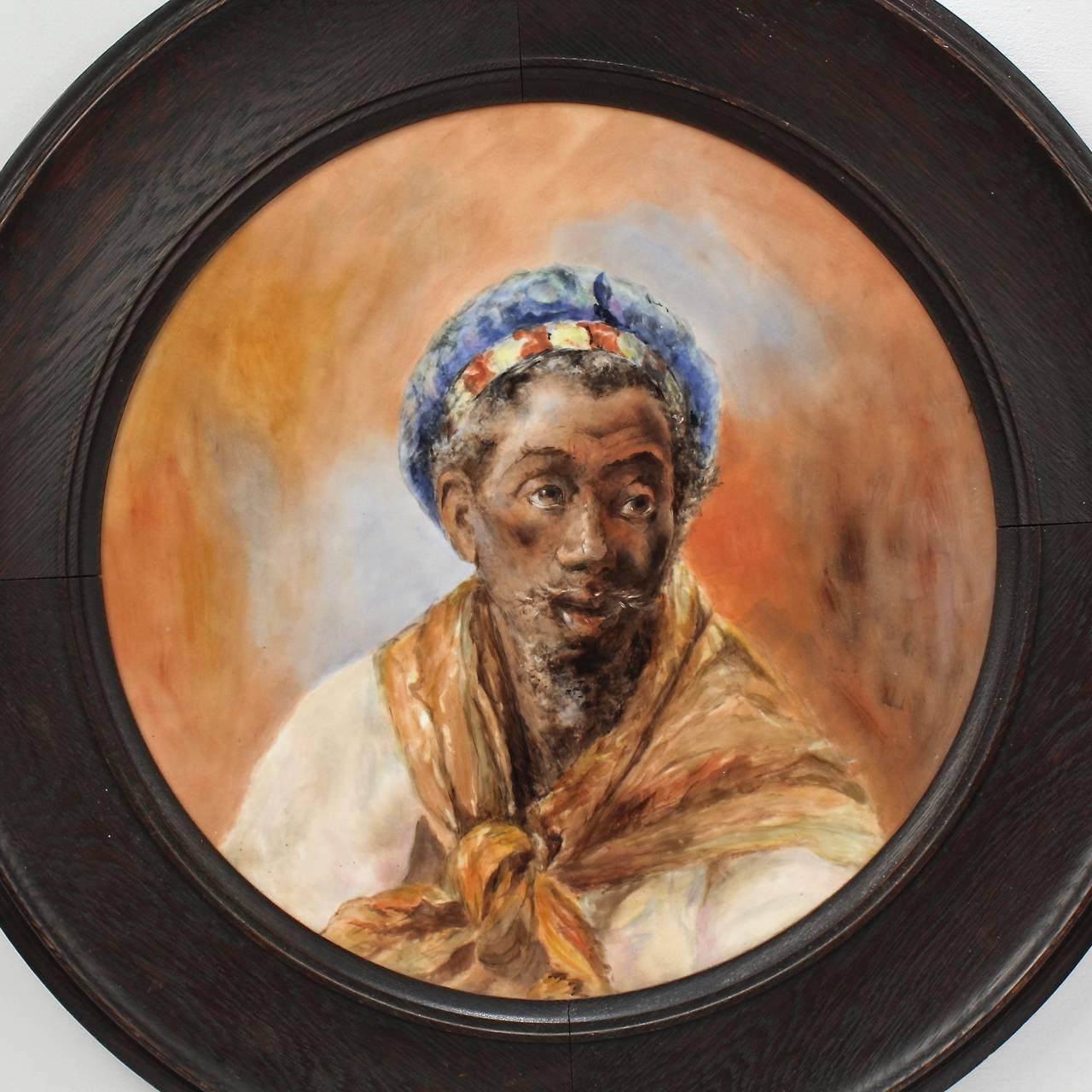 A fantastic, large-scale antique Orientalist hand-painted Limoges wall plaque.

Depicting a North African sitter in three quarter profile much in the style of Jean Joseph Benjamin-Constant’s ‘Head of a Moor’ or the many Spanish Moor paintings by