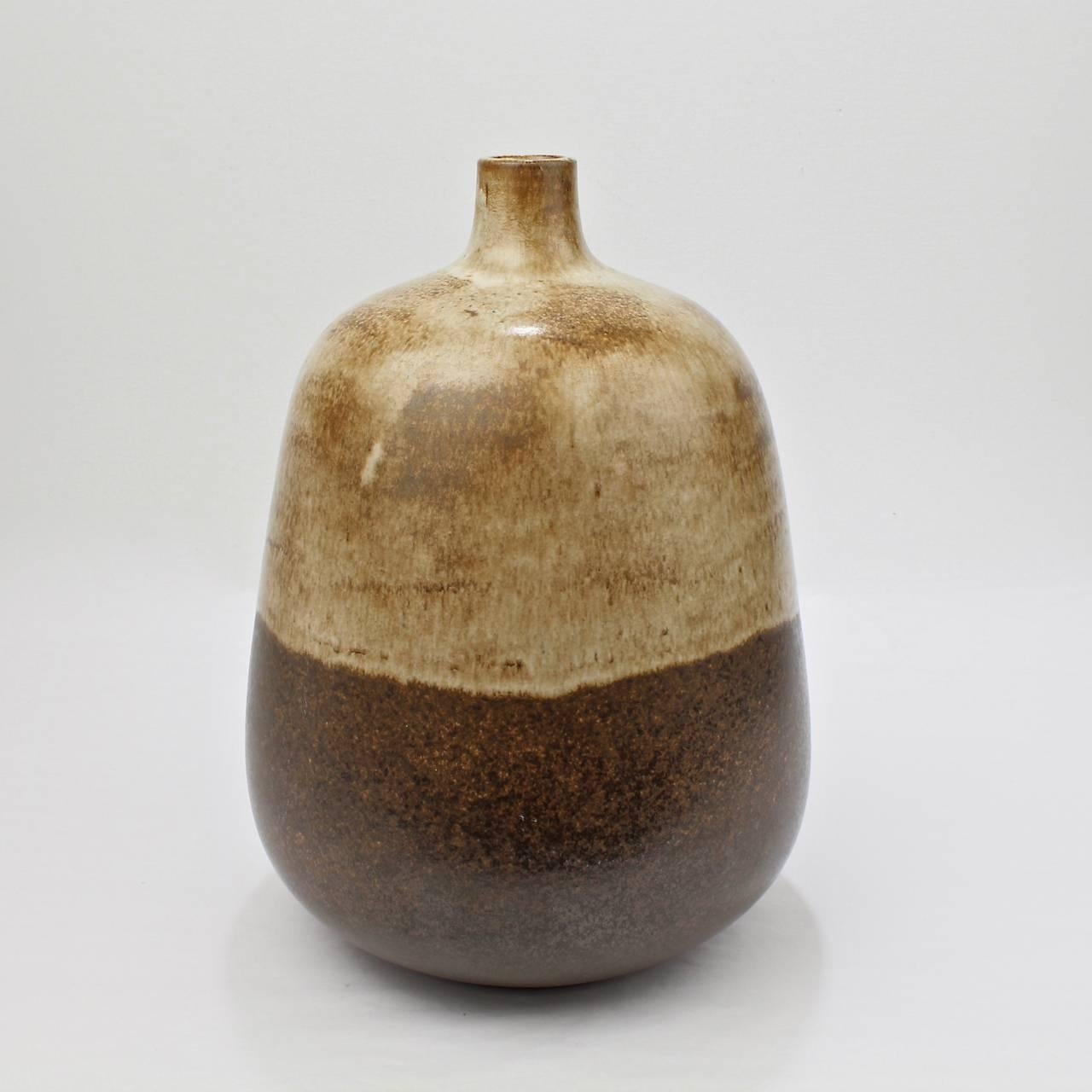 A cool, tear-drop form Mid-Century Italian pottery vase by Alvino Bagni for Raymor.

With a mottled brown tone-in-tone glaze. 

Bears it's original label to the base.

Height: ca. 10 3/4 in.

Items purchased from David Sterner antiques must
