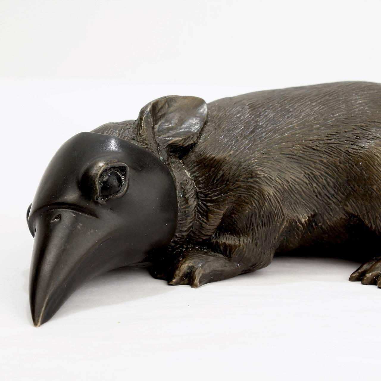 Baby bunny with crow's mask. 

A bronze sculpture by Darla Jackson.

Orginally modelled in 2011. This piece was cast in 2015.

Signed and dated to base: d j 2015.
Measures: 
Length circa 7 1/8 in.

Also available in white painted and black
