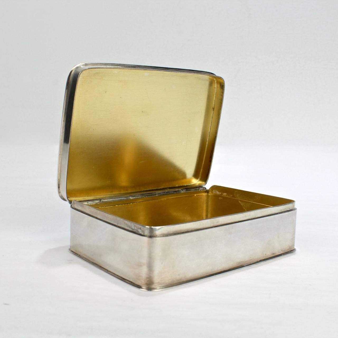 A fine Art Deco small Art Deco dresser box with sleek, simple lines and a gilt interior.

By Körner and Proll Silvermiths, who were active in Berlin in the late 19th and early 20th centuries.

Fully hallmarked to the base.

Measures: Width ca.