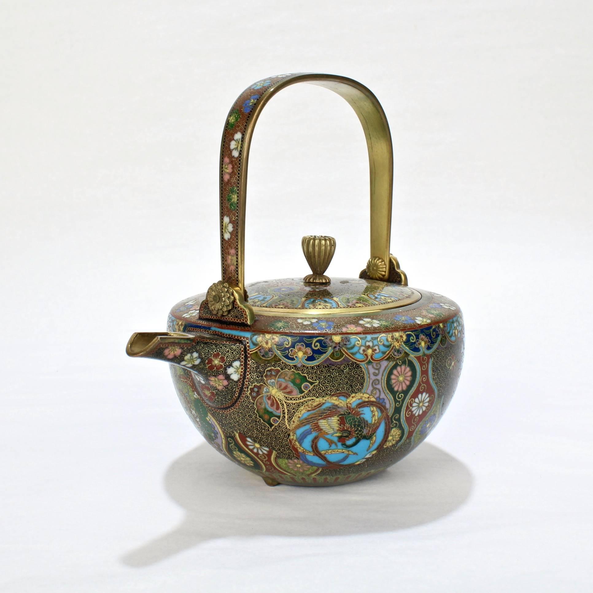 A very fine, diminutive Japanese cloisonné sake pot and cover.

Meiji period.

In the style of the Kyoto masters like Namiwaka Yasuyuki.

Measure: Height ca. 5 1/4 in.

Items purchased from David Sterner Antiques must delight you. Purchases