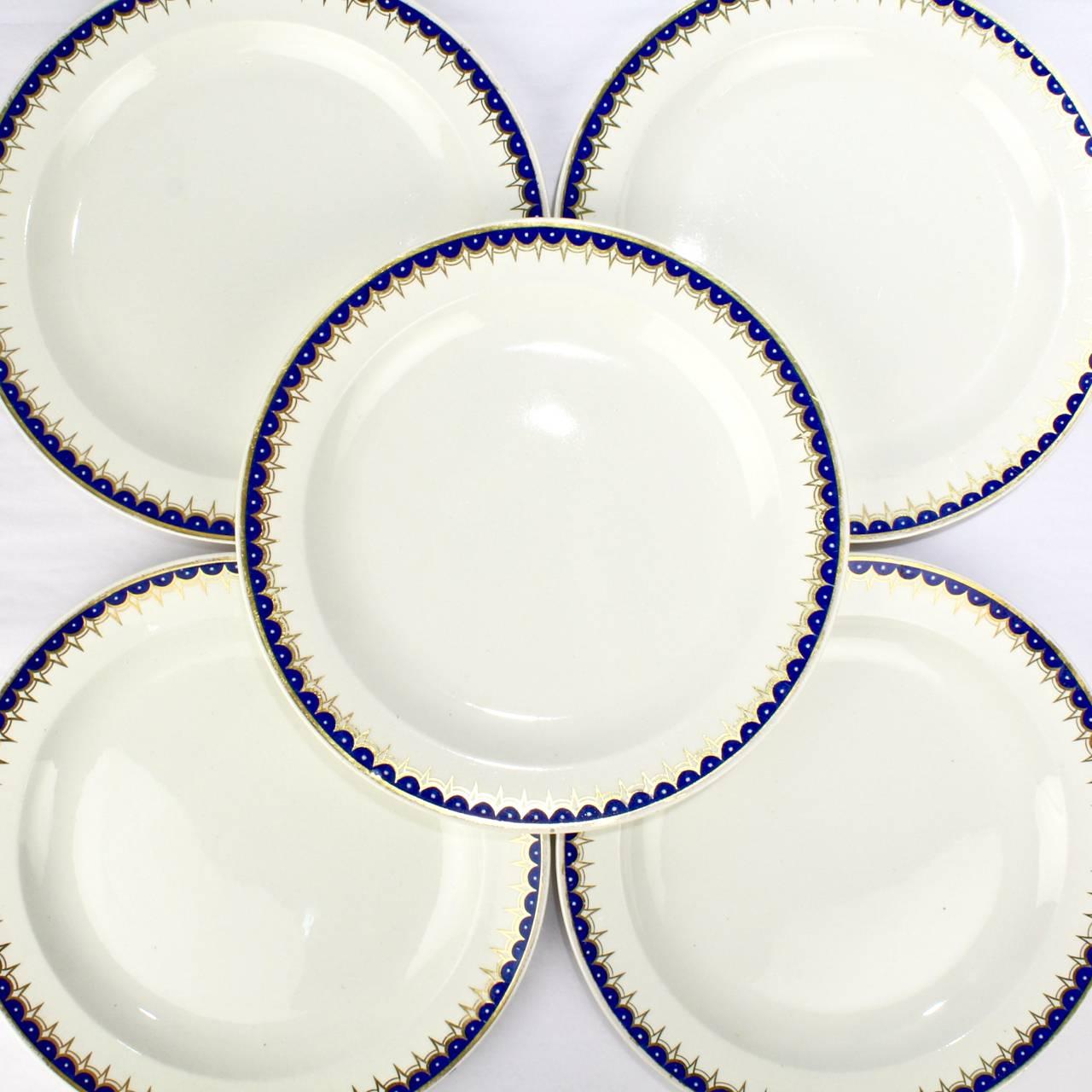 A terrifically rare set of Wedgwood creamware dinner plates.

In the neoclassical pattern no. 892 with a cobalt blue and gold border.

Measures: Diameter: ca. 9 3/4 in.

The reverse bears impressed factory marks.

(We will include two