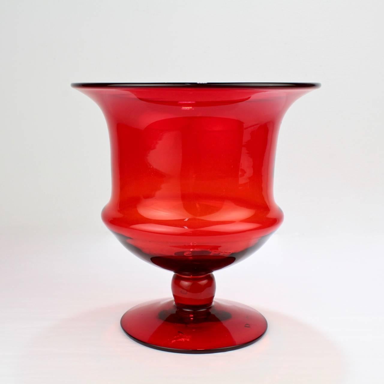 A vintage Murano glass campagna form champagne or wine bucket.

In thick walled blown red glass. Base with a rough pontil mark.

Measure: Height ca. 9 3/4 in.


 