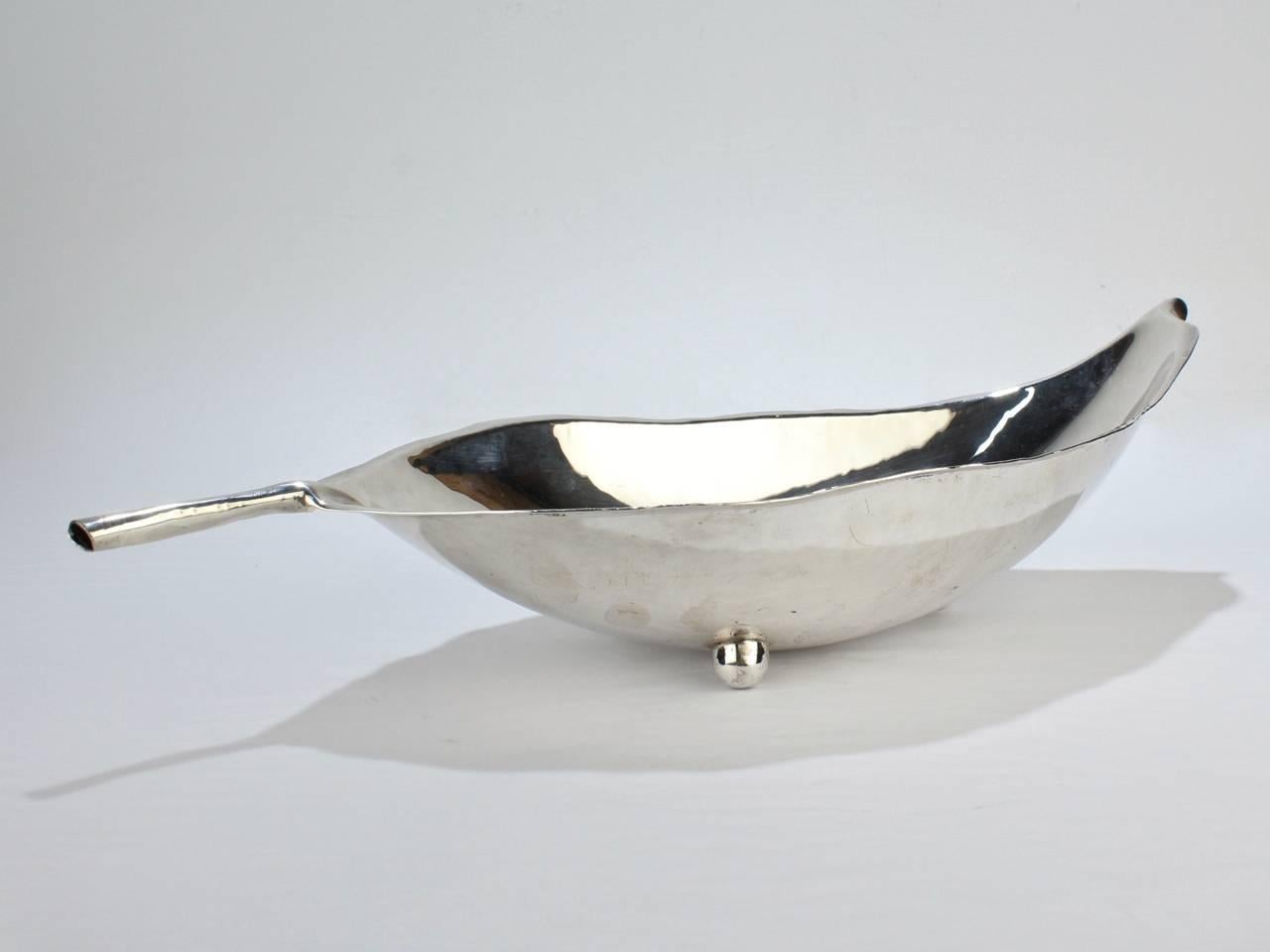 A large-scale example of Alfredo Sciarrotta's signature sterling silver leaf bowls. 

Handmade in Sciarrotta's silver shop, this large version was produced for and retailed by Cartier. 

Simply a fine example of American craft silver from one of