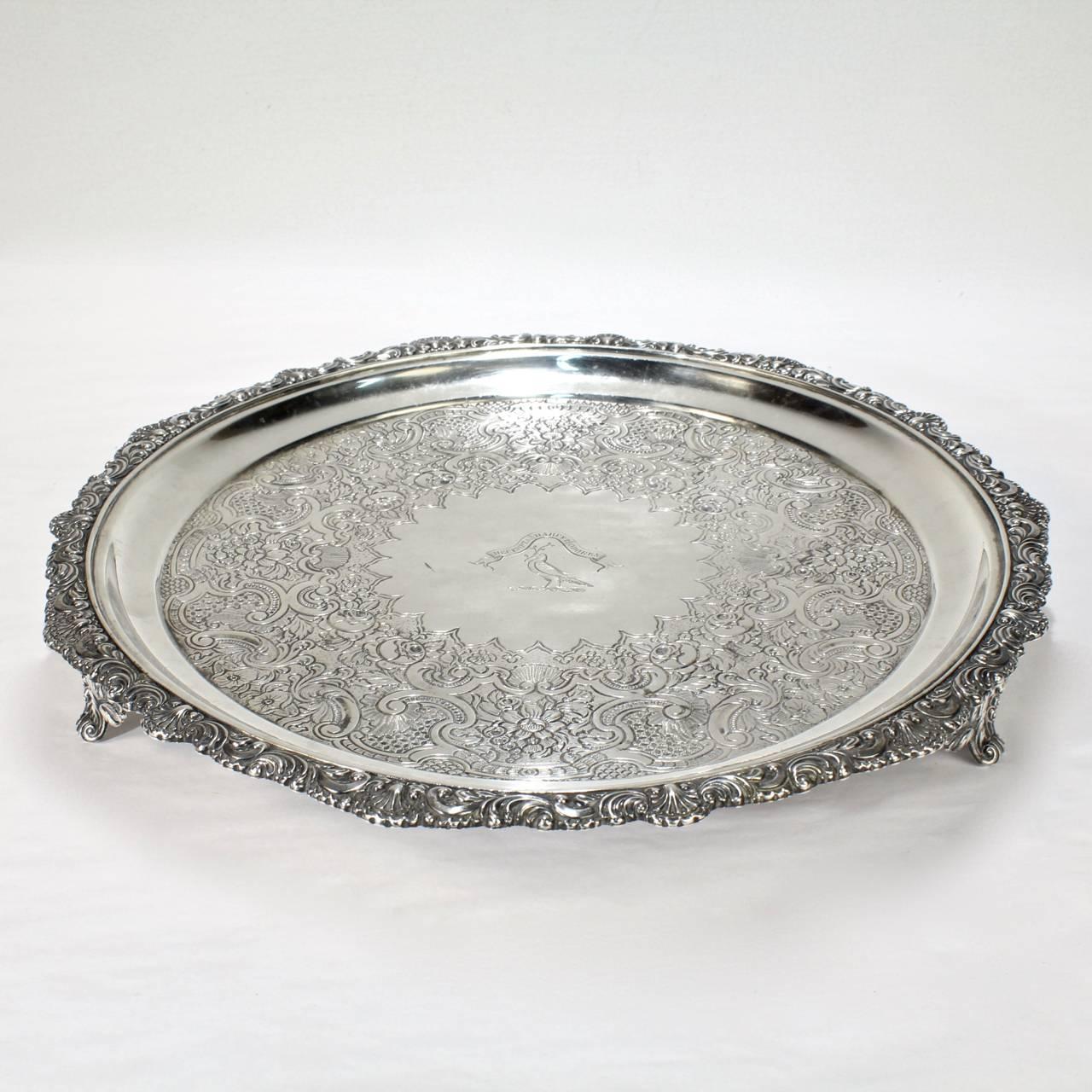 A good, heavy Scottish Regency period sterling silver salver with scalloped edge, floral decoration, and engraved crest and motto.

Made by George McHattie in Edinburgh in 1824.

With an engraved family crest for the Hunter-Marshall family of