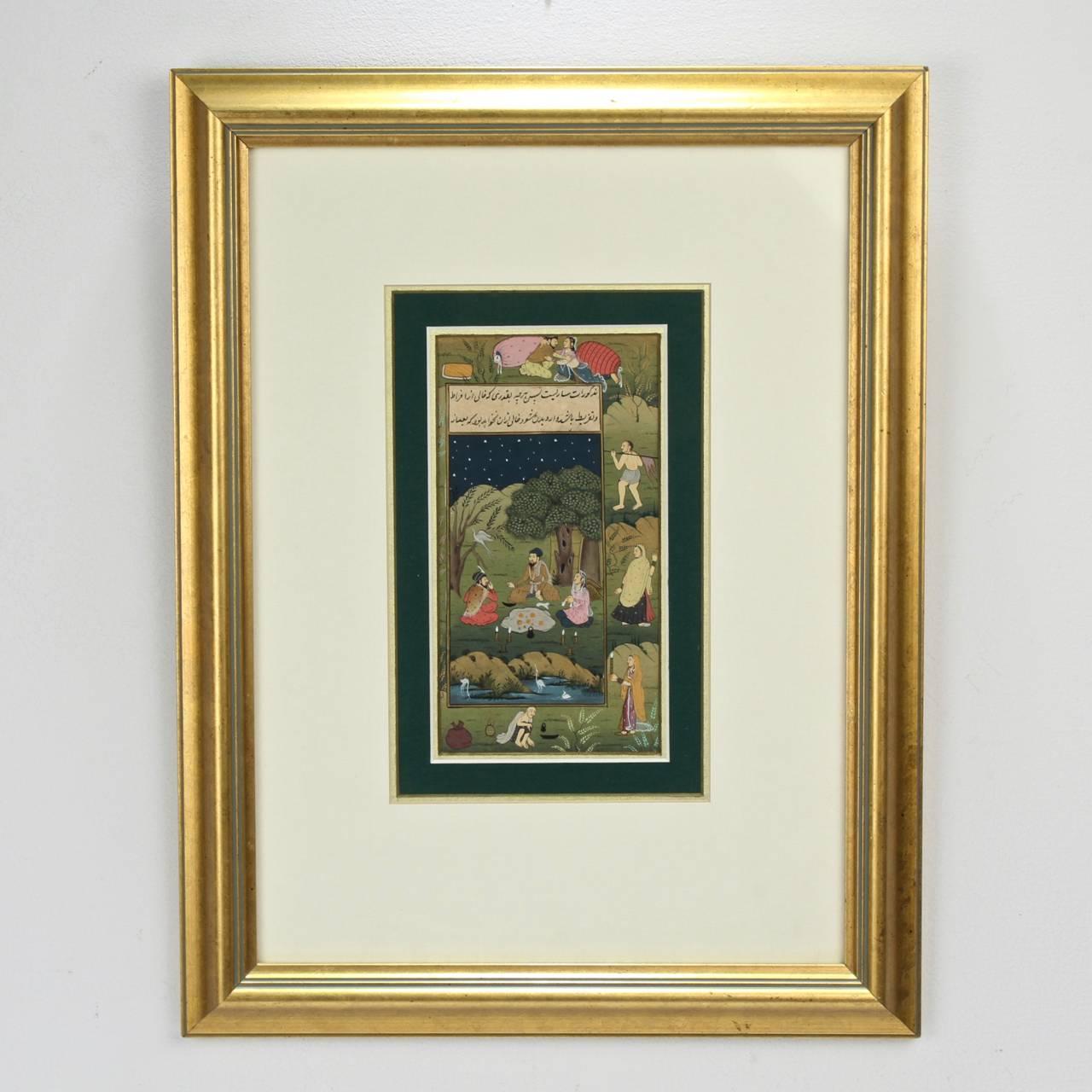 A fine antique Indian or Indo-Persia Moghul Islamic Illustrated manuscript folio.

Depicting an outdoor picnic scene, a lover's vignette, and other small scenes.

Polychrome hand-illustrated decoration on paper. 

Mounted under matte and glass