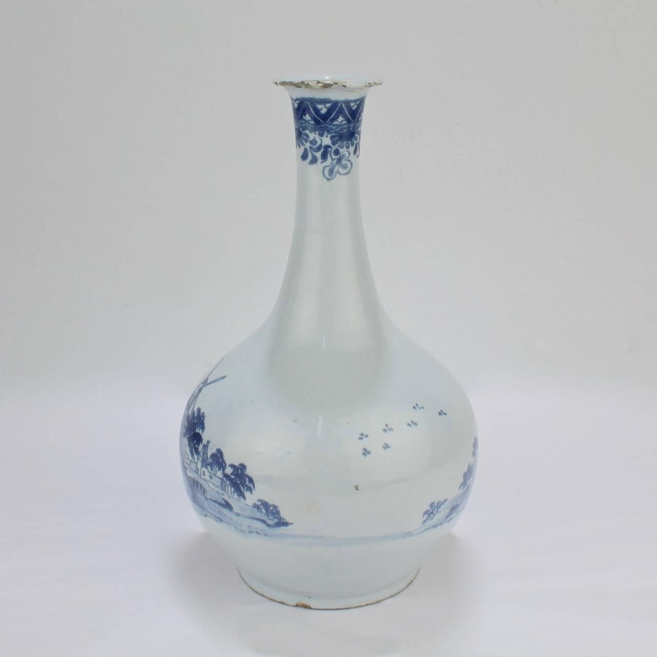 A rare bottle-form English delft vase. 

The decoration includes a windmill scene to the front and a castle scene to the reverse. 

The base bears an old F H Garner collection sticker to the base. 

Measures: Height: ca. 9 3/4 in.


 
