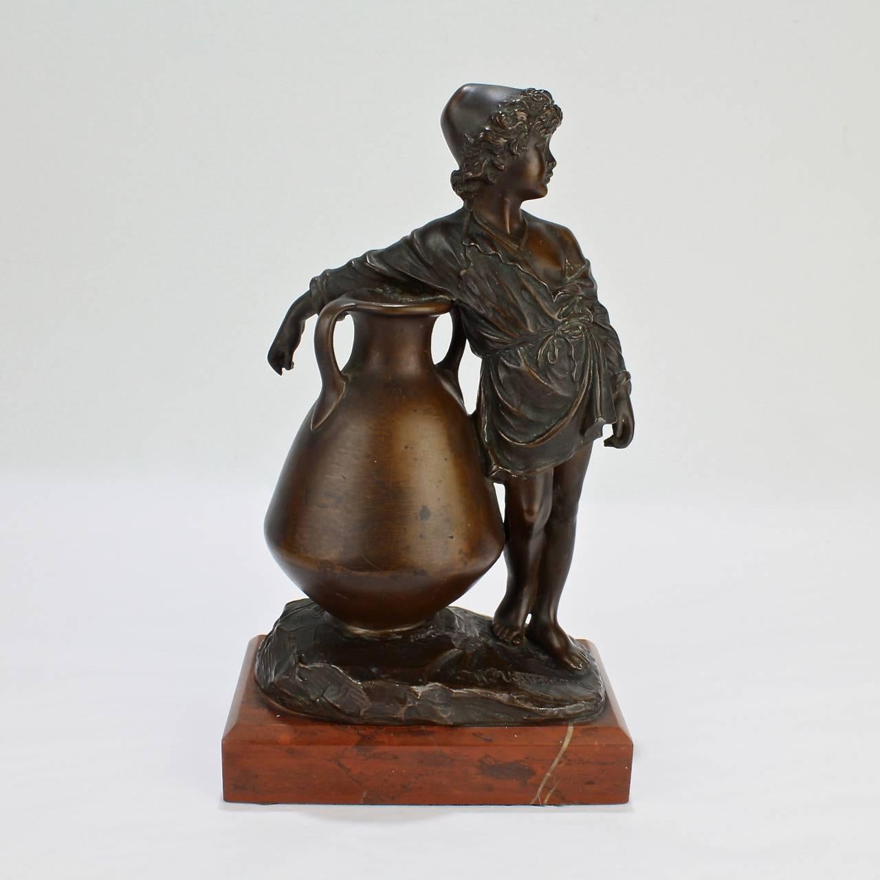 A good Belle Epoche bronze modeled as a young boy beside a large amphora or vase.

Stylistically informed by Orientalism and various Revival movements active in Europe at the end of the 19th century.

Mounted on a rouge marble base.

Base