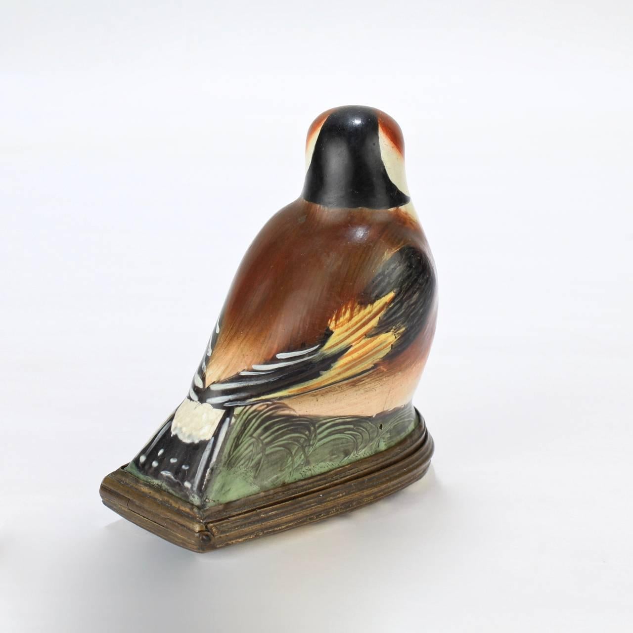A good antique figural bird form Battersea or South Staffordshire enamel bonbonniere.

The lid has bronze mount and a bird on a branch decoration.

Length: ca. 2 1/2 in.


 