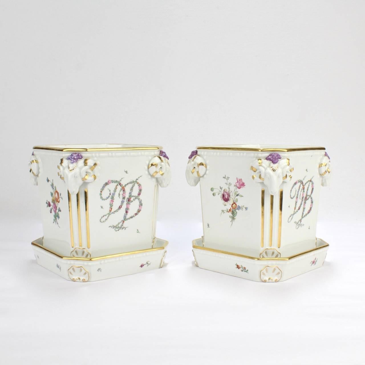 A compelling pair of vintage Royal Copenhagen porcelain cachepots or flower pots.

The pots bear the monogram DB in floral garlands to fronts (like as an homage to the royal Madame du Barry Sevres porcelain service) and Deutsche Blume style flower