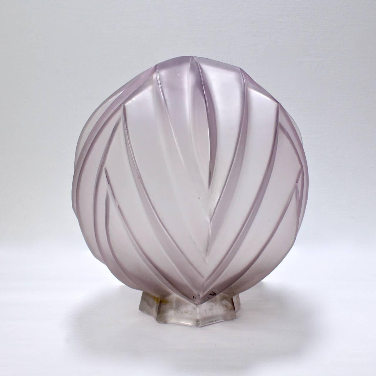 A rare period French Art Deco frosted globe from lampshade by Sabino for the French Market.

With a grey to purple frosted patina and a geometric or prism design.

The fitter neck bears a raised Sabino, Paris factory mark.

Measure: Diameter