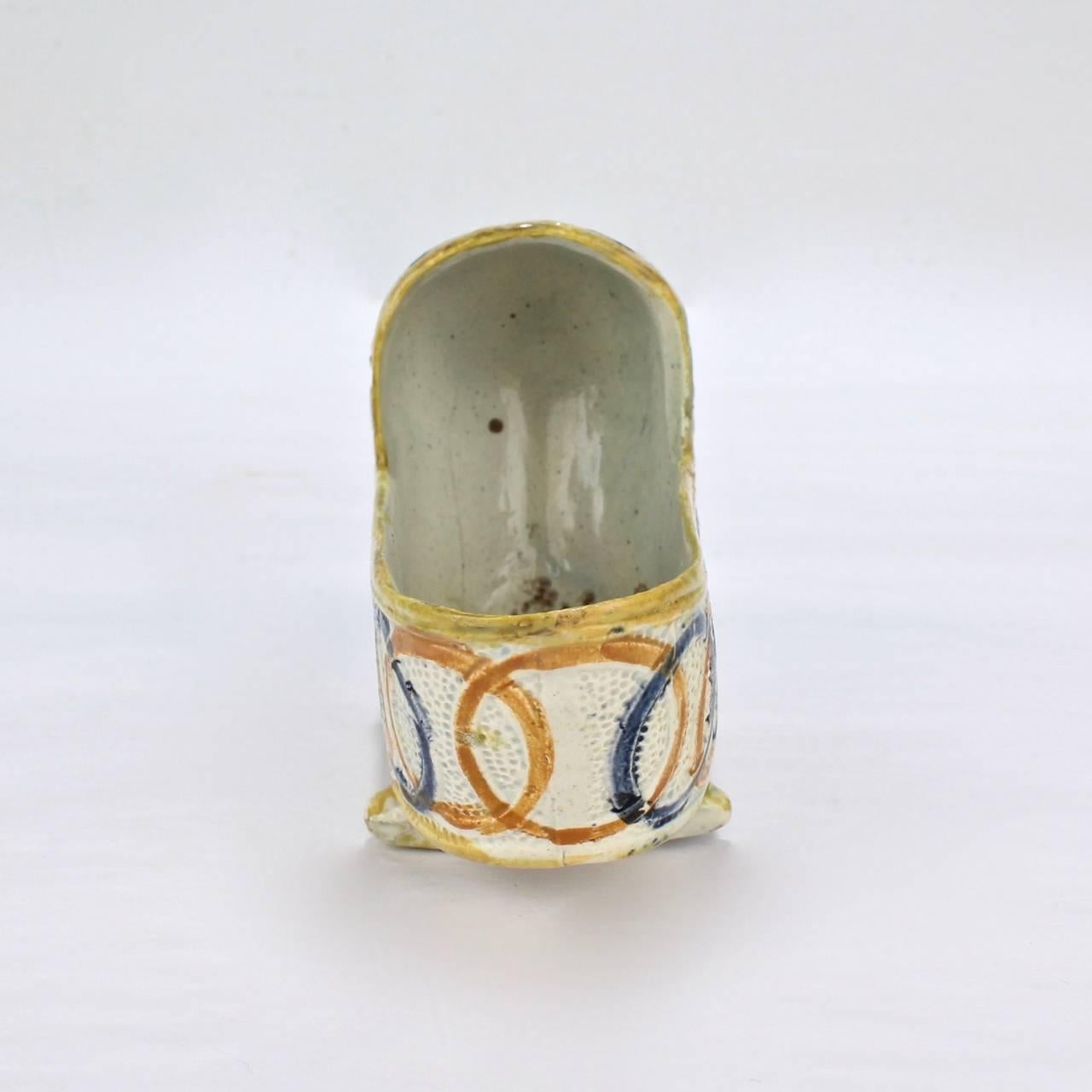 A good rare Prattware pottery model of a baby's cradle.

Decorated with orange and blue intersecting circles throughout the body and embellished yellow and green highlights,

circa 1800.

Measure: Length ca. 4 1/4 in.





  