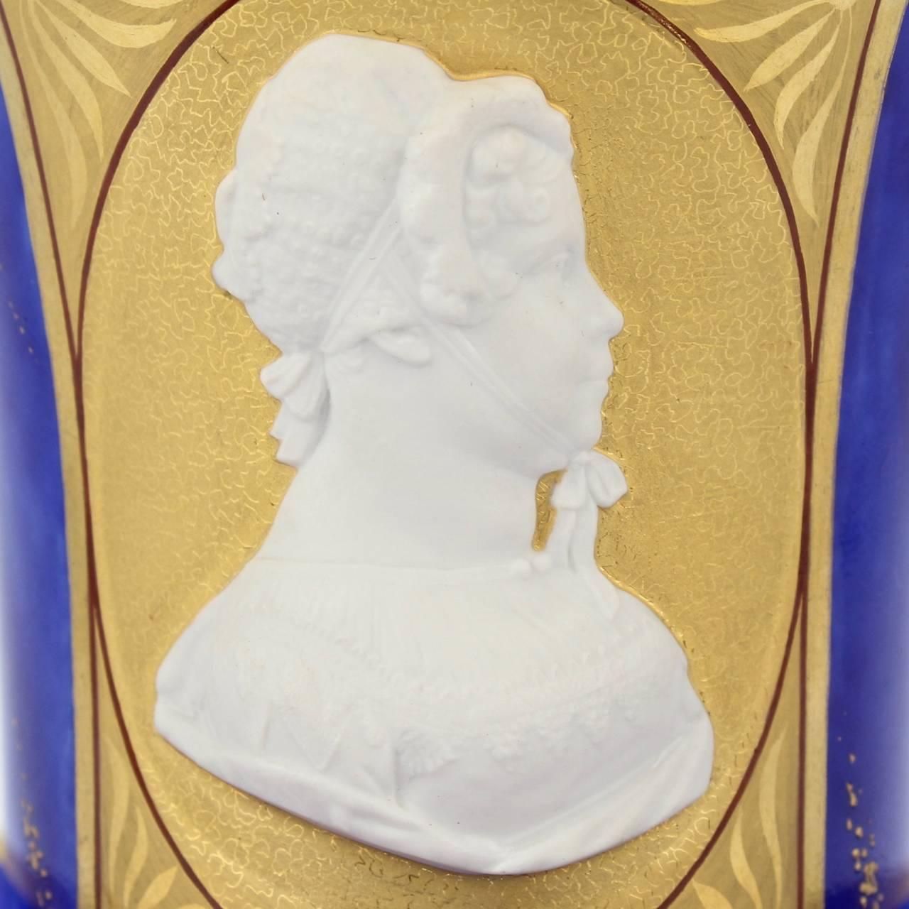 A wonderful and rare KPM Berlin cameo portrait cup and saucer.

A cameo relief bisque portrait depicting Queen Frederika Louisa is centred in a gold cartouche surrounded by a mottled lapis blue ground with gilt highlights.

The cup's foot and