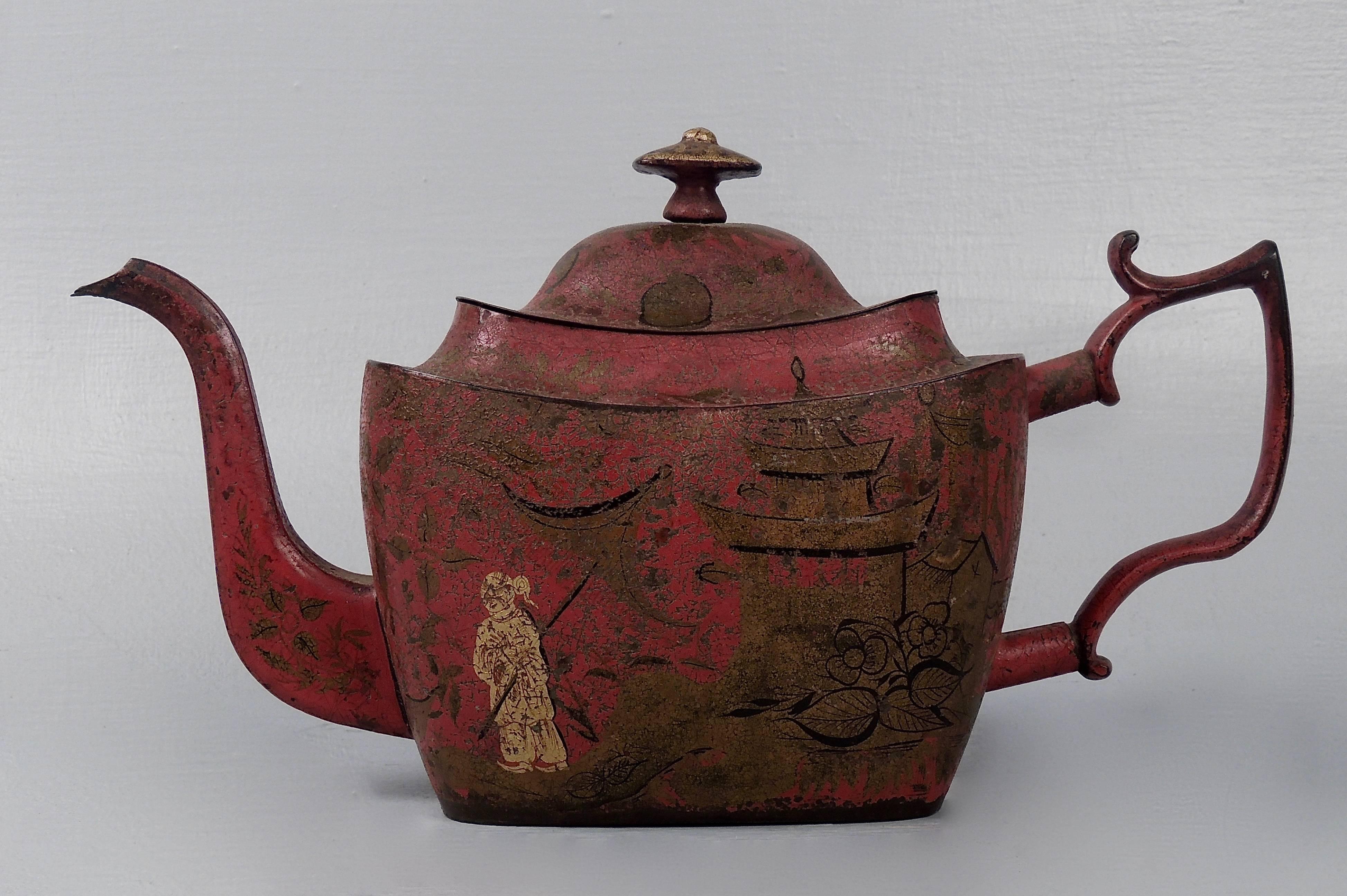 A fine georgian red tole paint or toleware teapot. This late 18th century piece is chinoiserie decorated throughout in gold and black on a red ground. A very rare form.

Height: circa 6.5 in. 
Length: circa 11 in. (handle to spout) 

Items purchased