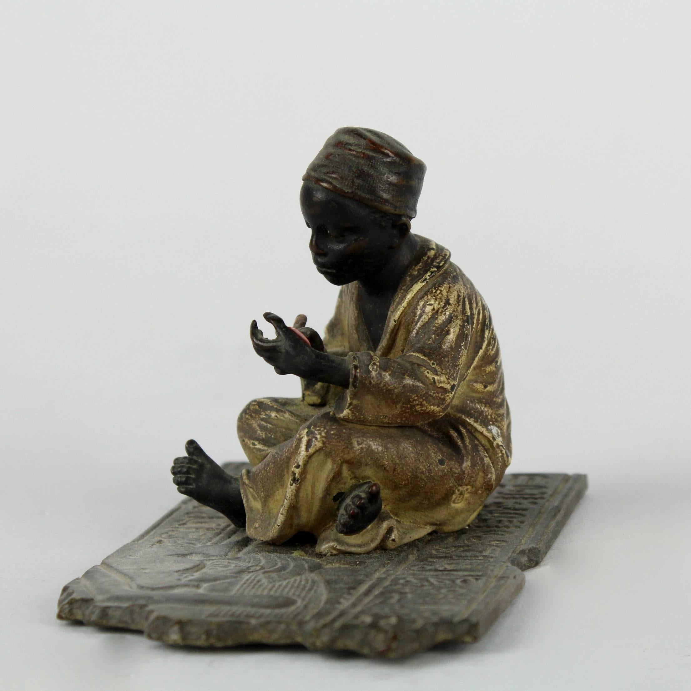 Austrian Cold Painted Orientalist Bronze Sculpture of a Seated Arab Boy by F. Bergmann